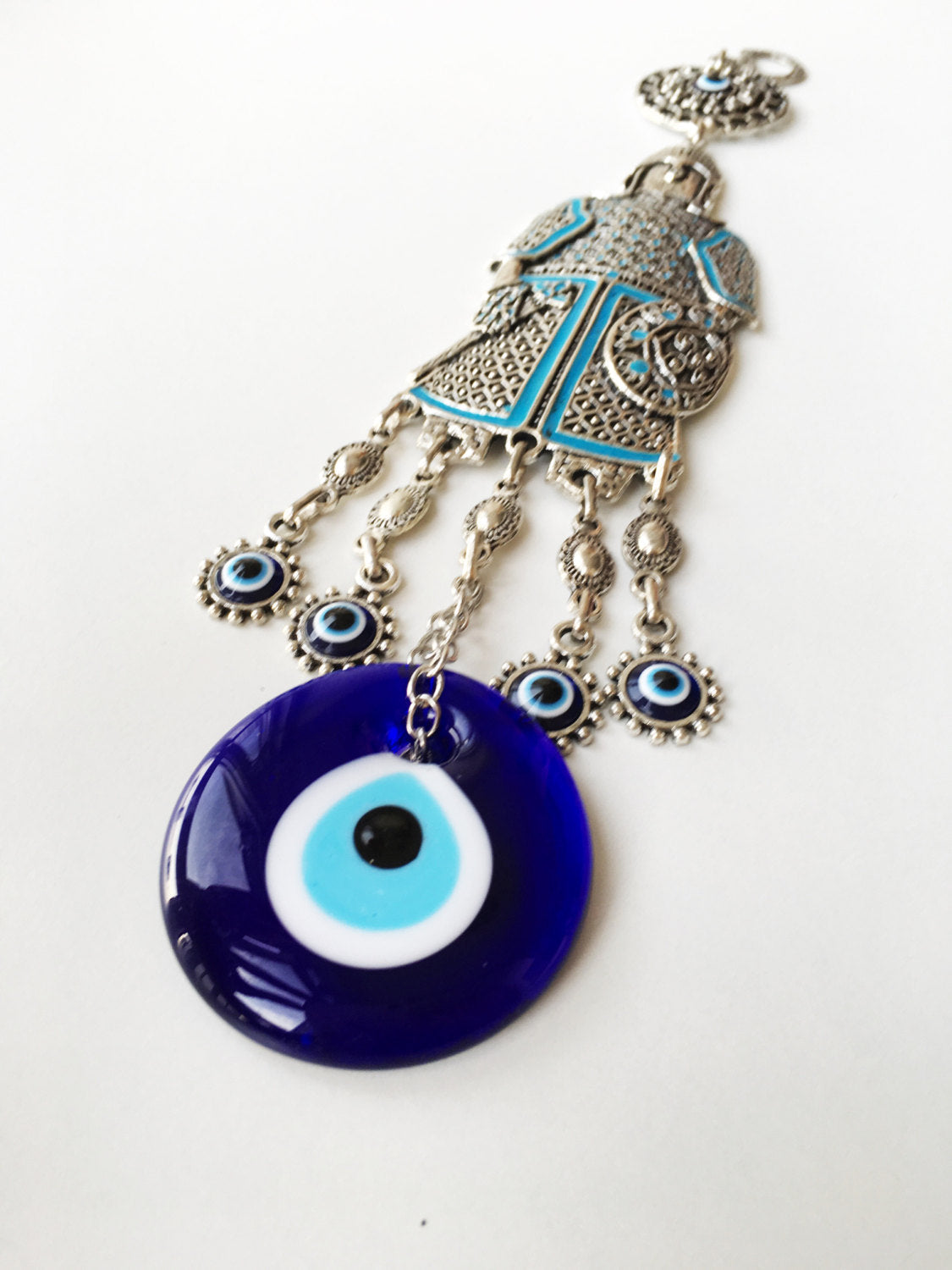 Handmade Knight Evil Eye Wall Hanging featuring vibrant glass evil eyes and metal symbols for luck and protection.