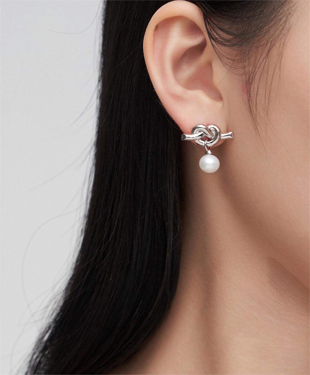 Elegant Knot Design Pearl Earrings featuring natural pearls and sterling silver, perfect for any occasion.