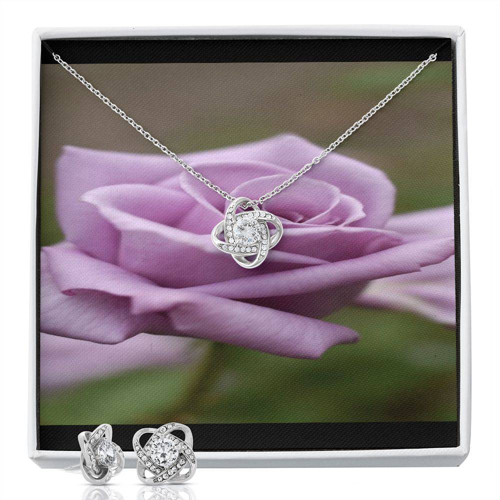 Knot Of Love Necklace featuring a Love Knot design in 14k white gold over stainless steel with a sparkling cubic zirconia stone.