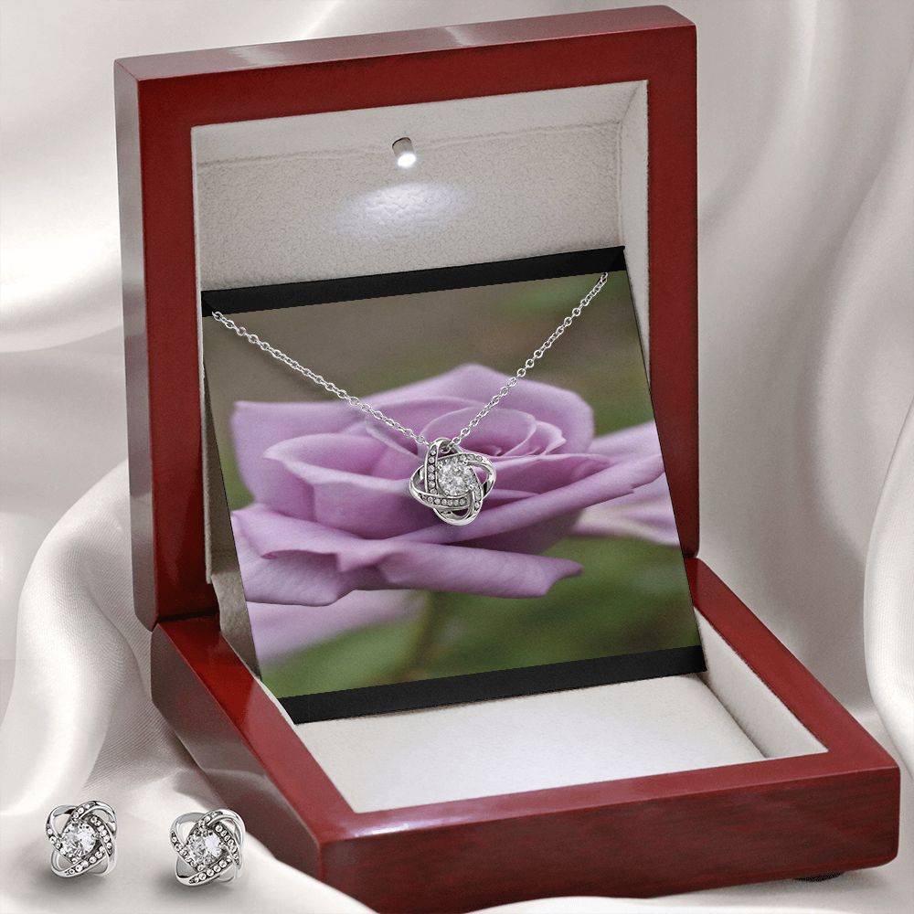 Knot Of Love Necklace featuring a Love Knot design in 14k white gold over stainless steel with a sparkling cubic zirconia stone.