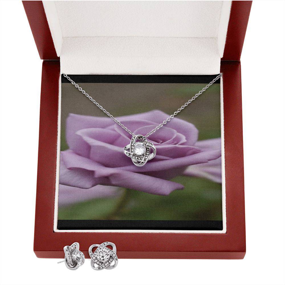 Knot Of Love Necklace featuring a Love Knot design in 14k white gold over stainless steel with a sparkling cubic zirconia stone.