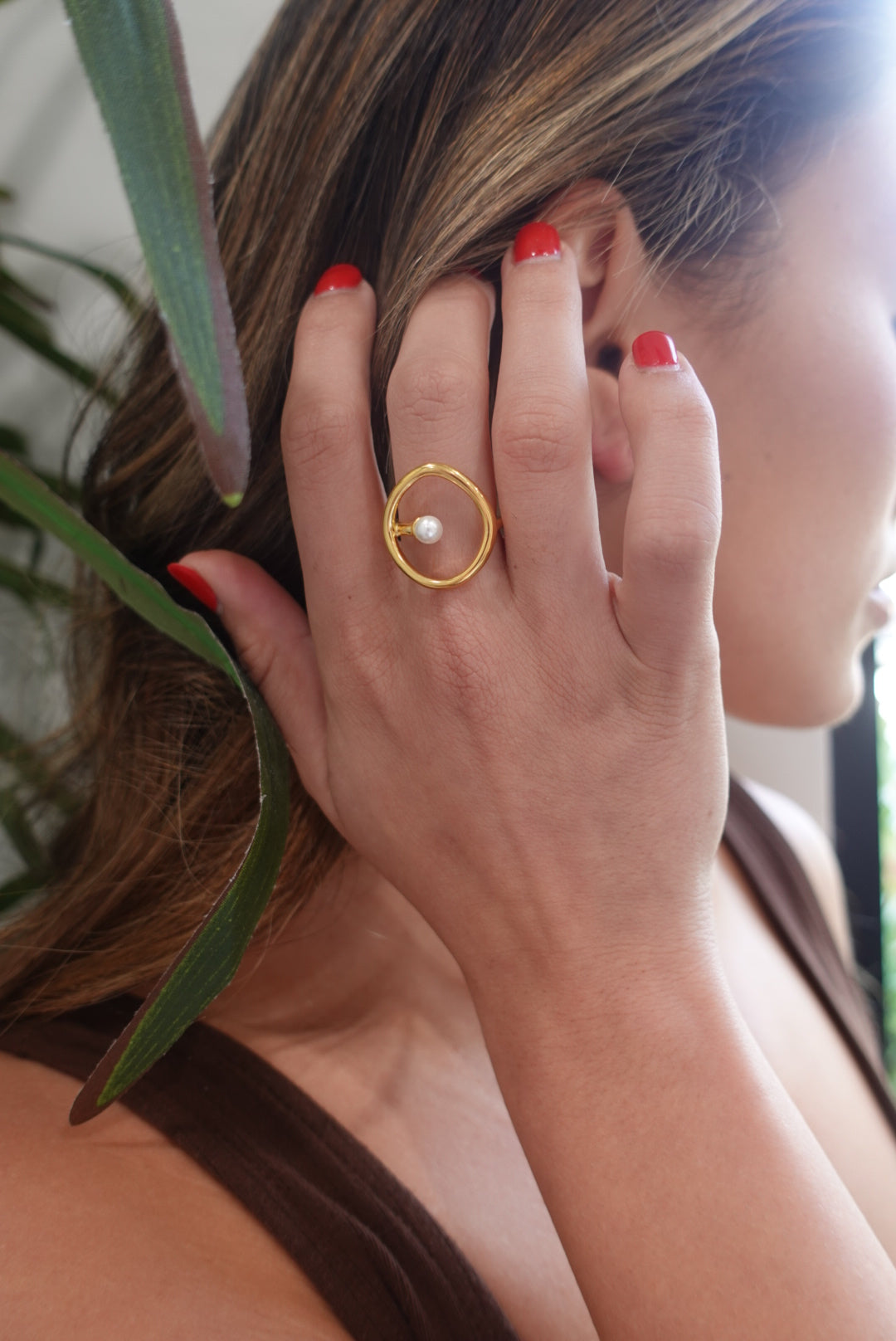 A stunning Krista Pearl Ring featuring a single lustrous pearl set in elegant 18K gold plating, perfect for any occasion.