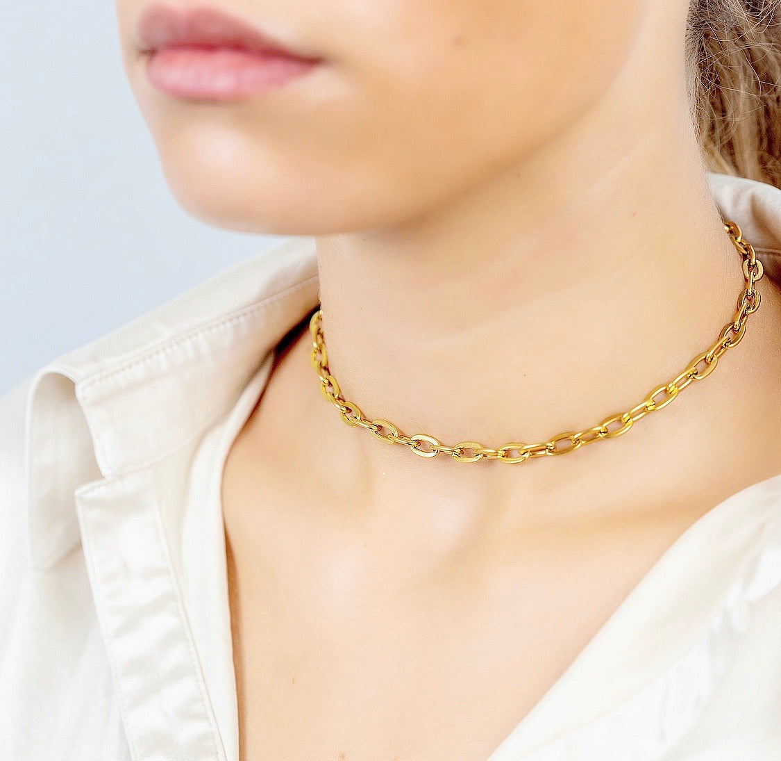 KYLIE Chain Choker featuring elongated slinky links in polished stainless steel with 18K gold plating, adjustable length for a perfect fit.