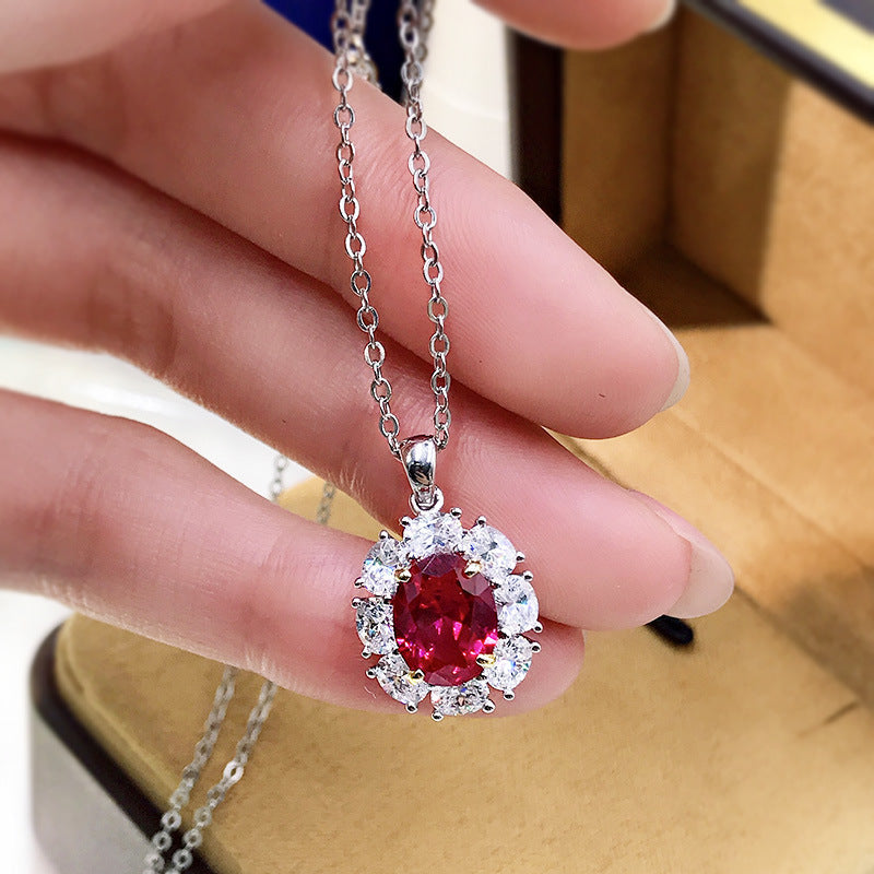 Elegant lab created ruby necklace in 925 sterling silver with cubic zirconia accents, showcasing a vibrant ruby pendant.