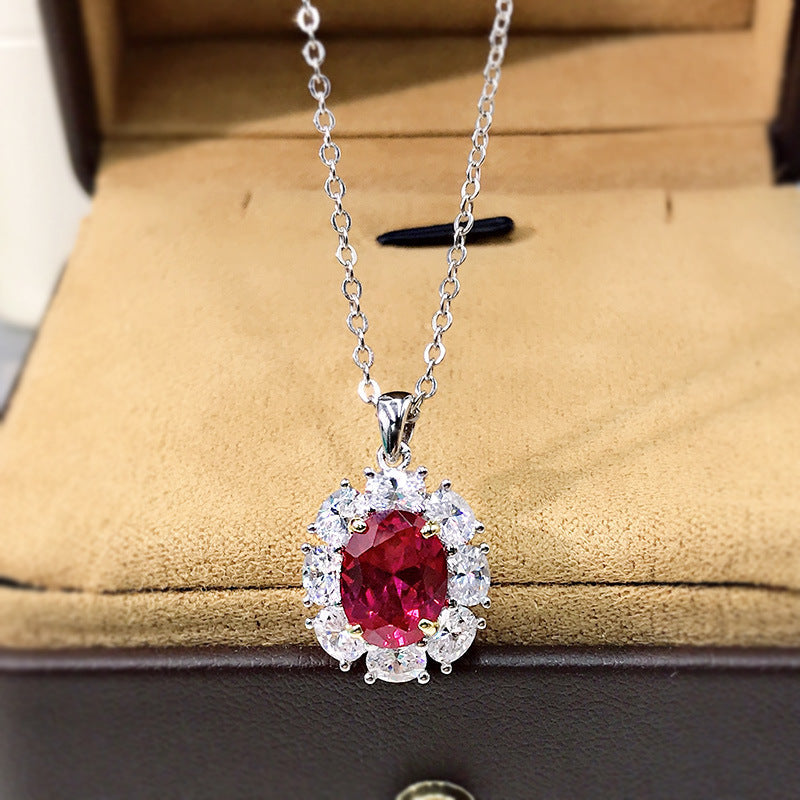 Elegant lab created ruby necklace in 925 sterling silver with cubic zirconia accents, showcasing a vibrant ruby pendant.