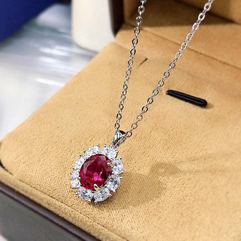 Elegant lab created ruby necklace in 925 sterling silver with cubic zirconia accents, showcasing a vibrant ruby pendant.