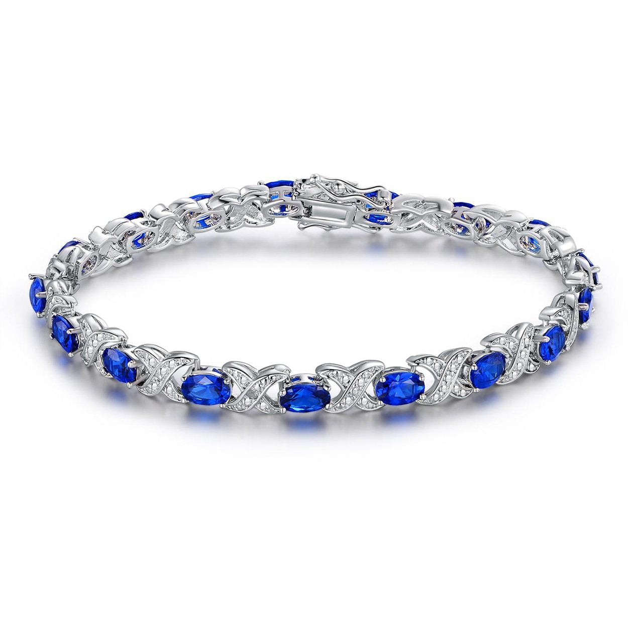 Lab-Created Blue Sapphire and Diamond Accent Tennis Bracelet featuring round stones and 18k white gold plating, elegantly designed for any occasion.