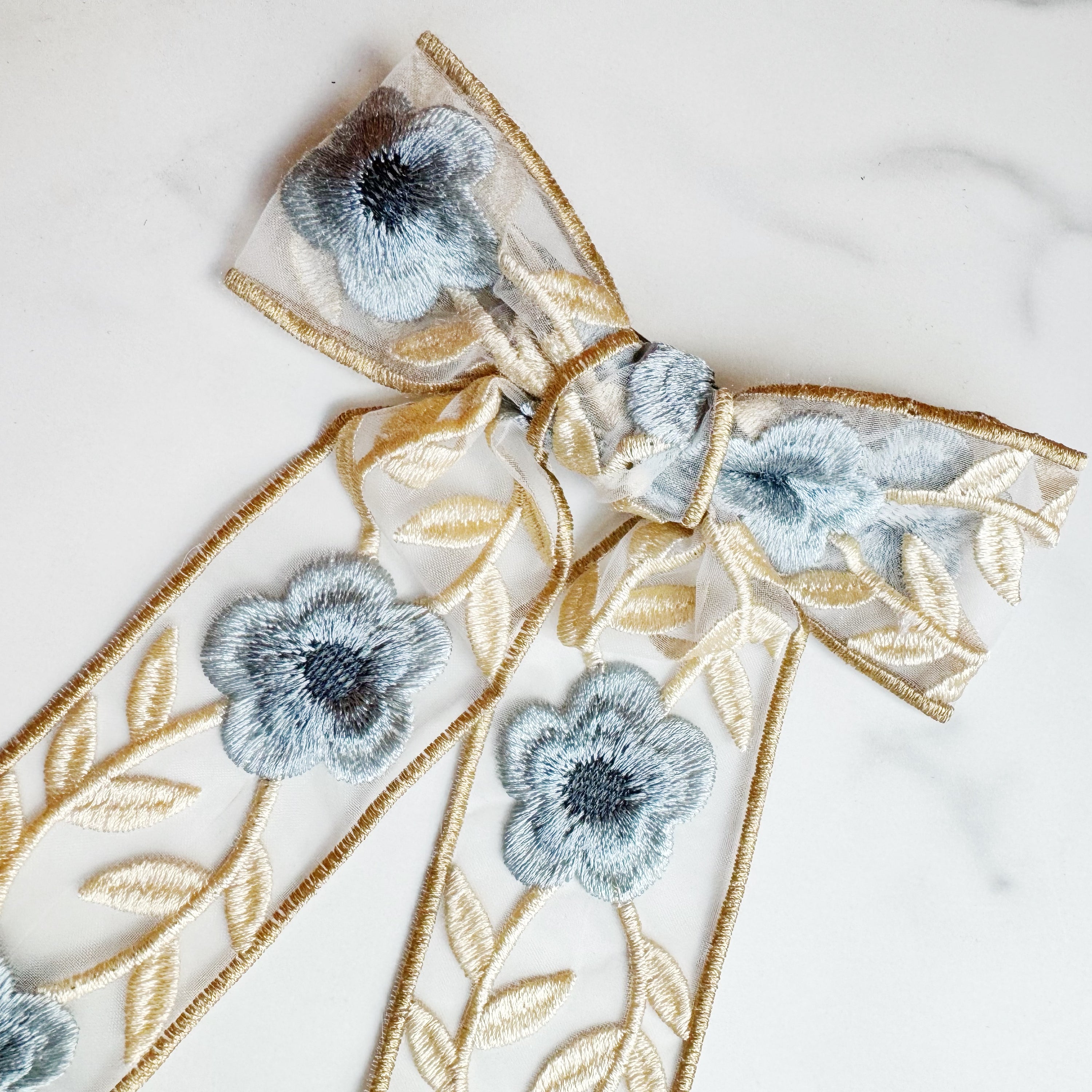 Lacey Flower Embroidered Bow Hair Clip featuring intricate floral design and delicate lace, perfect for elegant hairstyles.