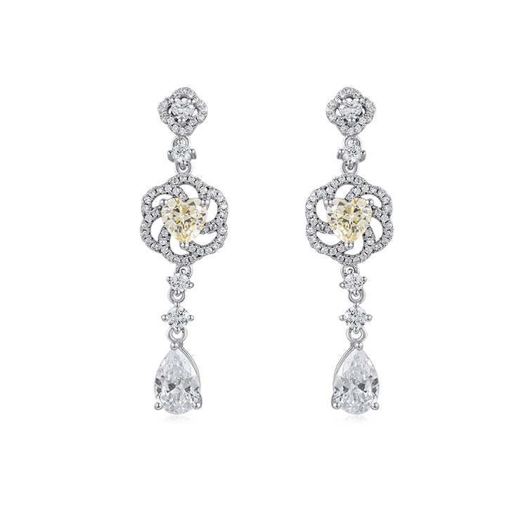 Lachouette lucky pear cut flower drop earrings made of sterling silver with white gold surface, featuring white sapphire and yellow citrine stones.