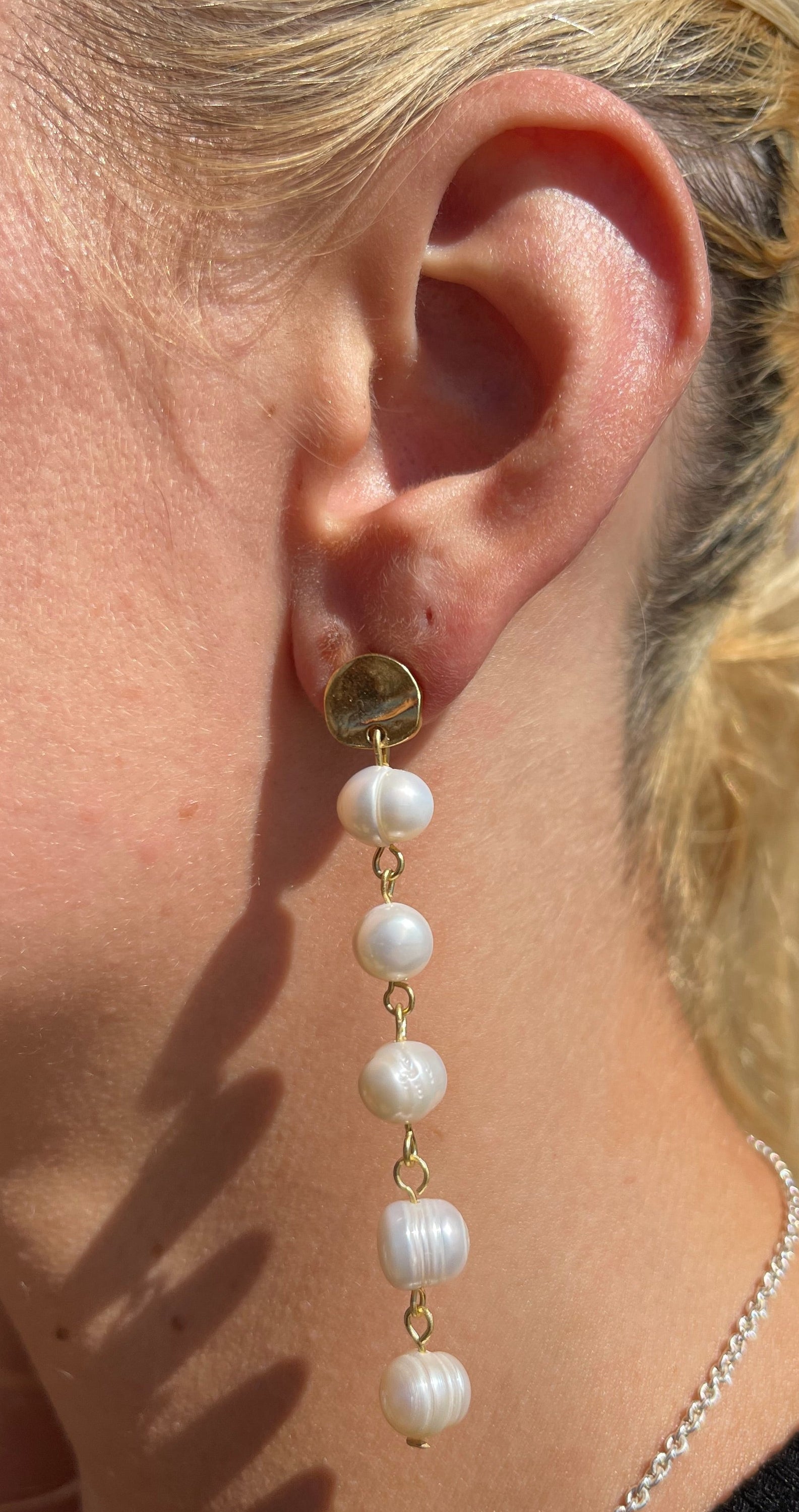 Lady Pearl Earrings featuring creamy white freshwater pearls and textured coin stud in gold, silver, or rose gold plating.