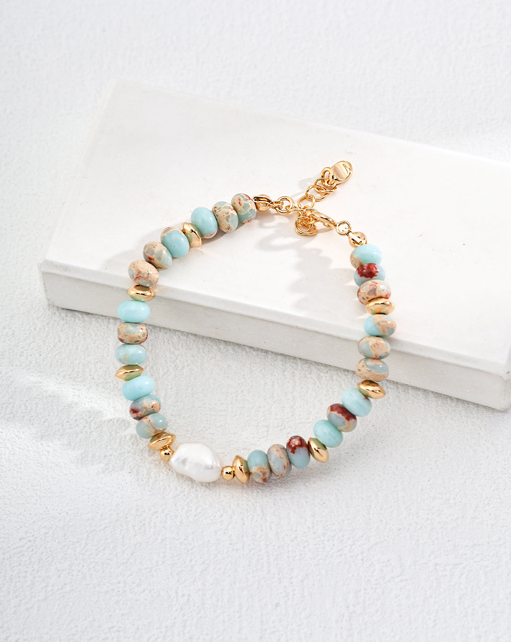 Lake Serenity Lardetite and Pearl Bracelet featuring blue stones and natural pearls on a vintage gold chain.