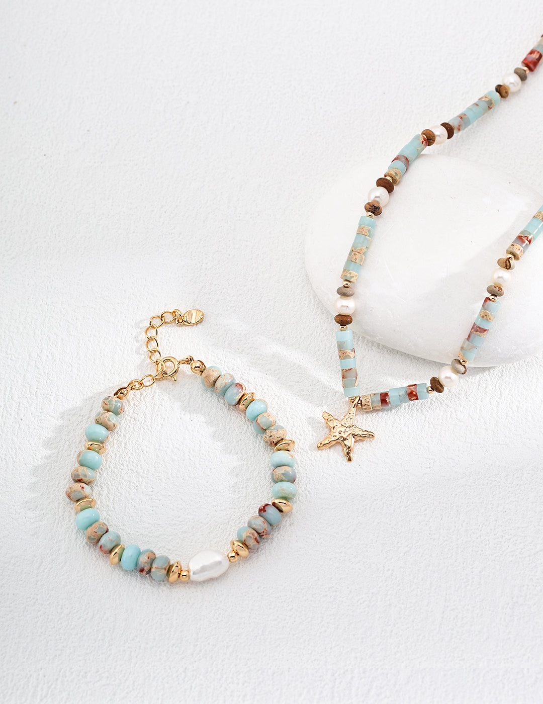 Lake Serenity Lardetite and Pearl Bracelet featuring blue stones and natural pearls on a vintage gold chain.