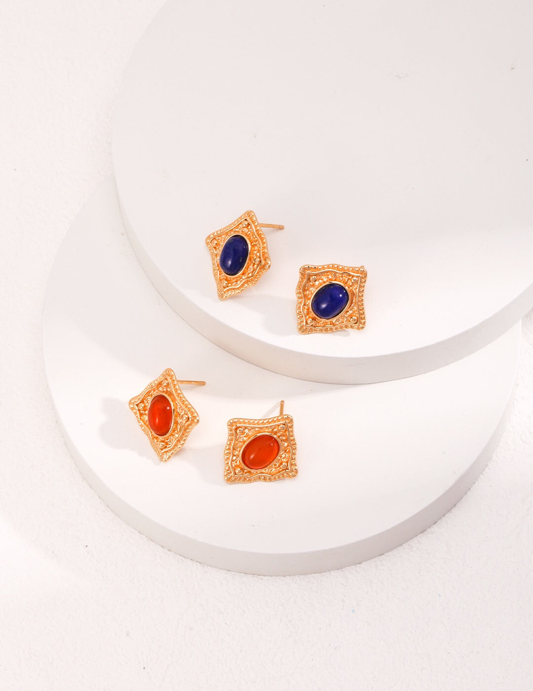 Handmade Lapis Lazuli and Carnelian stud earrings with gold vermeil setting, showcasing vibrant colors and elegant design.