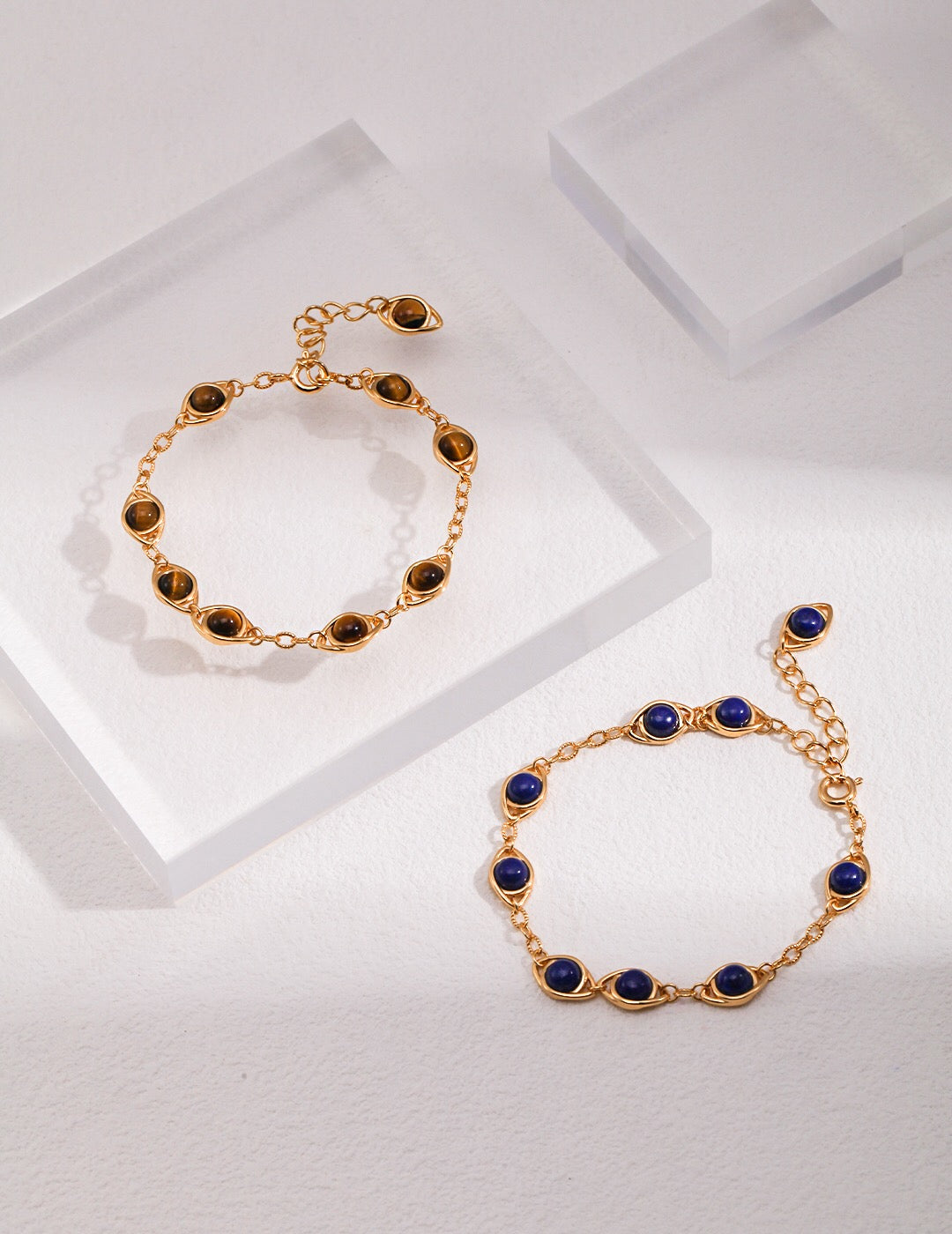 Handmade adjustable bracelet featuring Lapis Lazuli and Tigers Eye stones with gold vermeil accents, elegantly displayed on a soft surface.