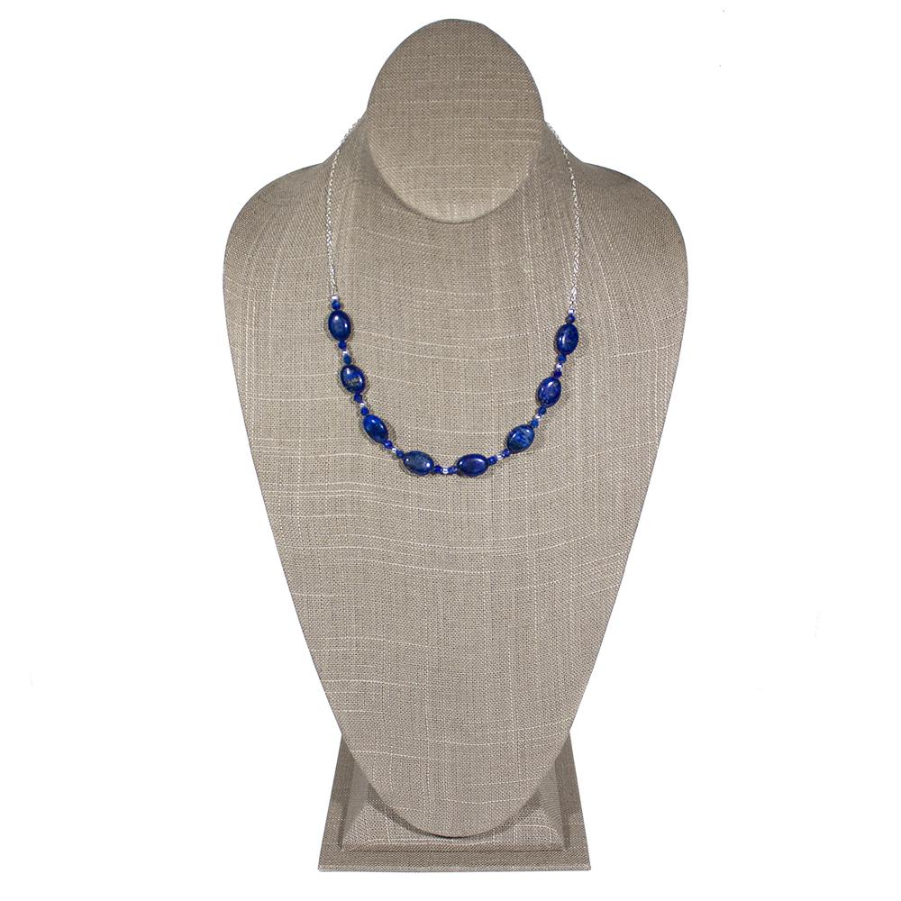 Lapis Lazuli U Sterling Silver Necklace showcasing deep blue gemstones with gold flecks, elegantly designed in a U-shape.