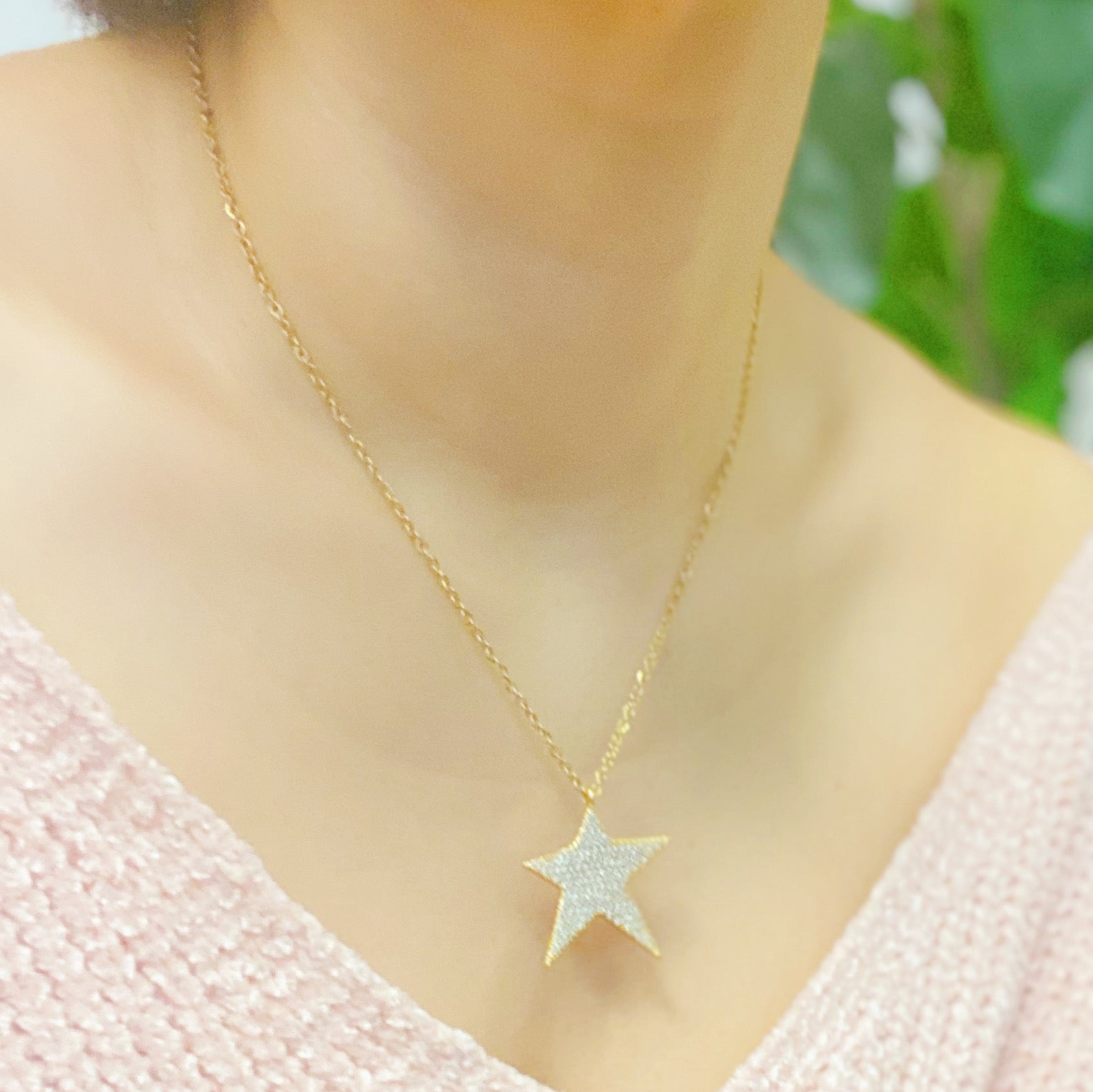 Lara Land Shiny Star Necklace featuring a star-shaped pendant adorned with cubic zirconia on a stainless steel chain.