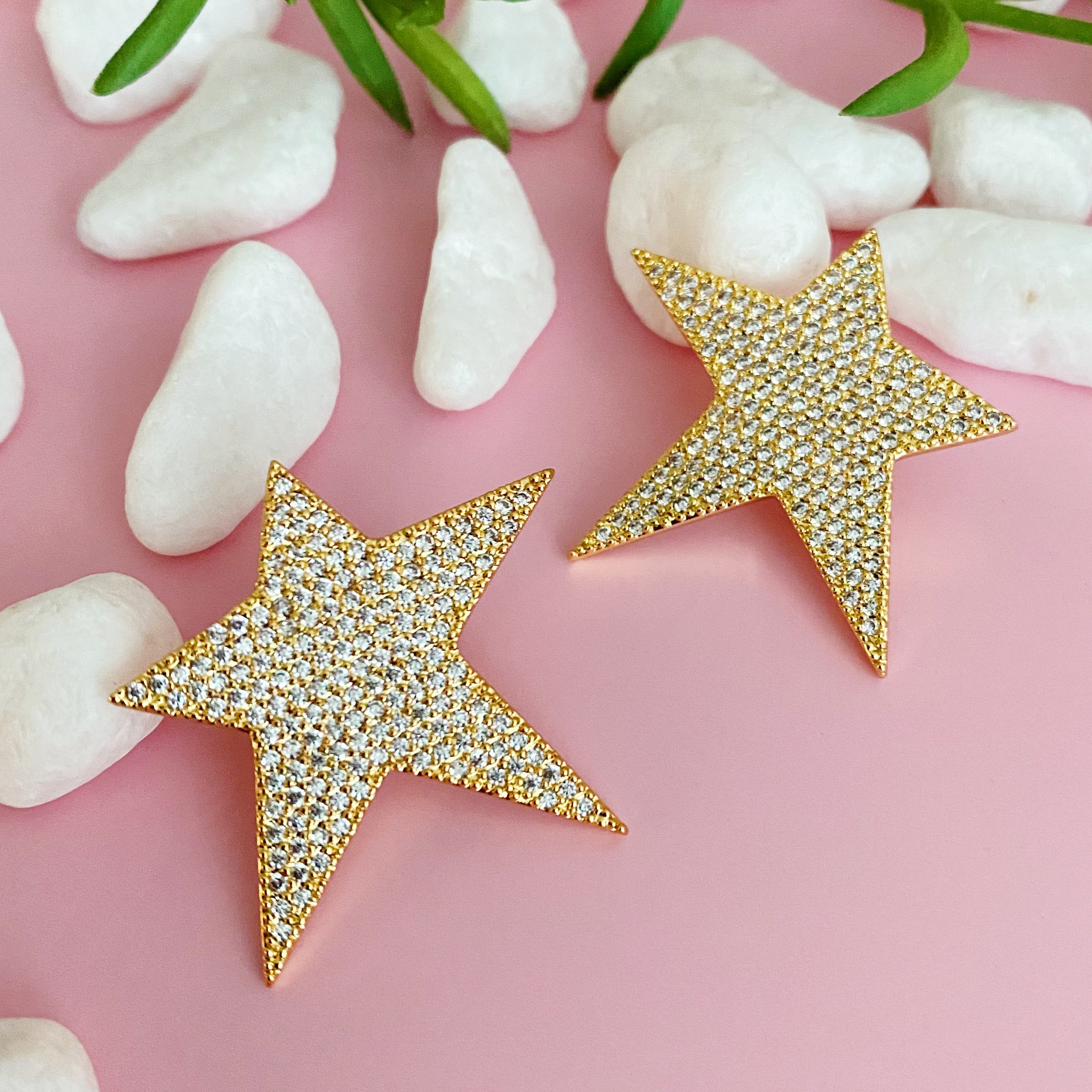 Lara Land Star Earrings featuring sparkling cubic zirconia in a classic star shape, elegantly displayed against a soft background.