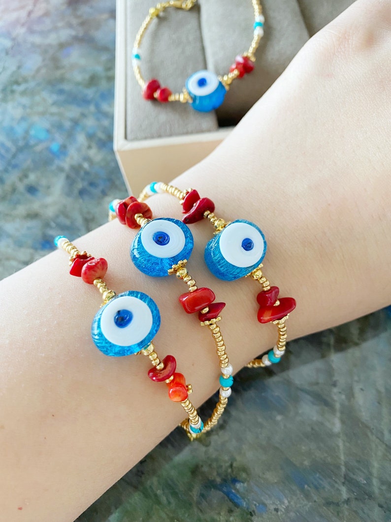 Large Evil Eye Bracelet featuring handmade glass beads, baroque beads, and vibrant seed beads in blue and turquoise colors.