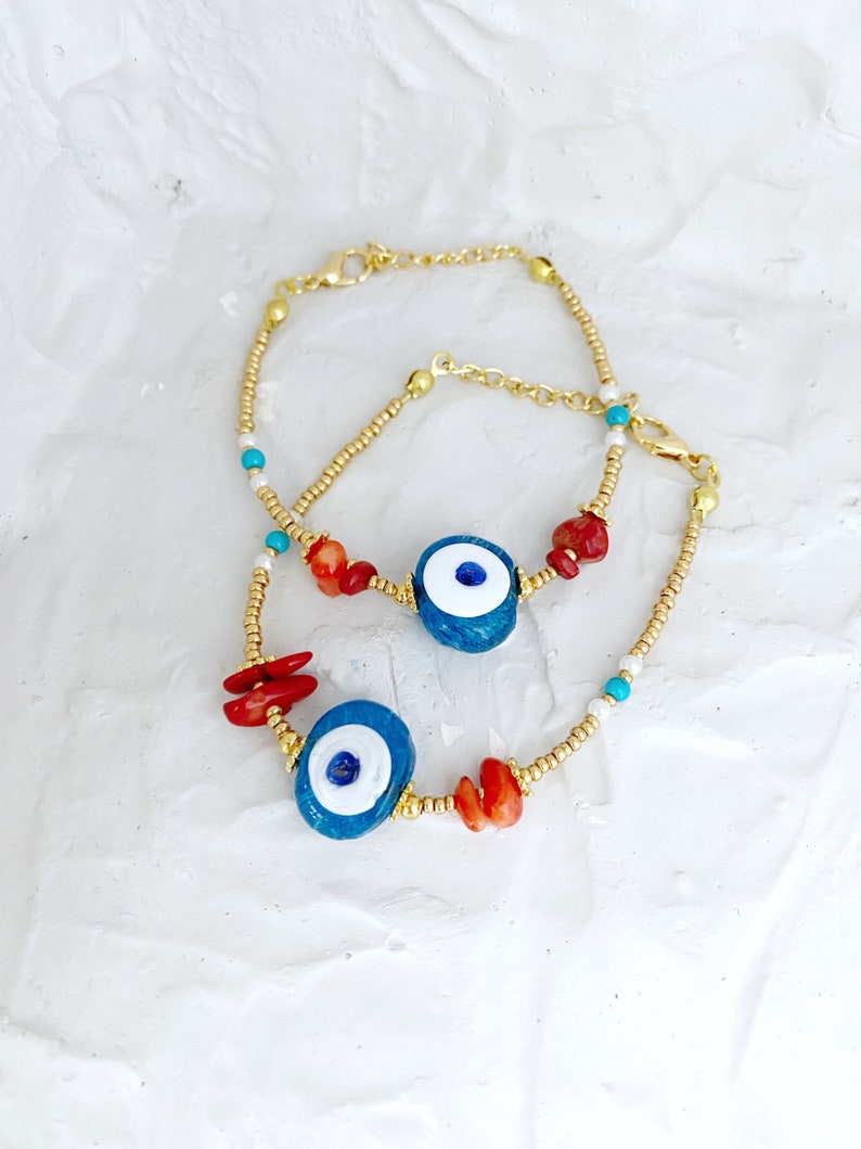 Large Evil Eye Bracelet featuring handmade glass beads, baroque beads, and vibrant seed beads in blue and turquoise colors.