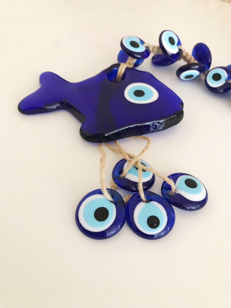 Large evil eye lucky fish wall hanging with 41 beads, featuring a big fish bead and multiple smaller glass beads, showcasing vibrant colors and intricate designs.