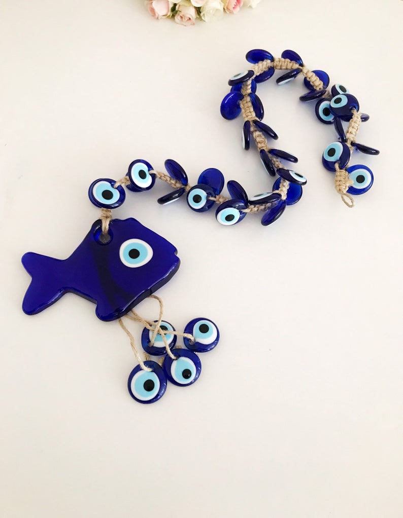 Large evil eye lucky fish wall hanging with 41 beads, featuring a big fish bead and multiple smaller glass beads, showcasing vibrant colors and intricate designs.