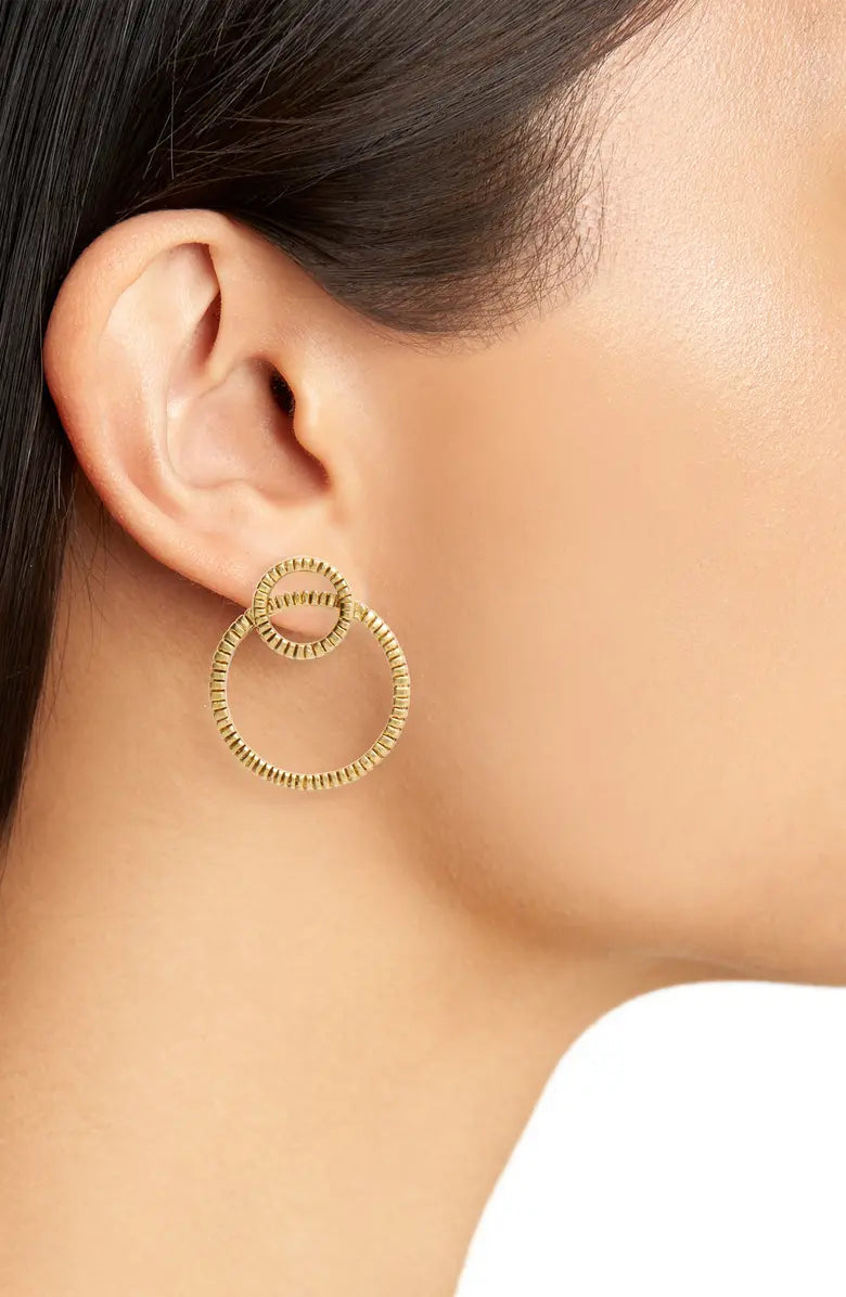 Large Frontal Circle Earrings featuring overlapping rings with an antique finish, available in gold and silver.