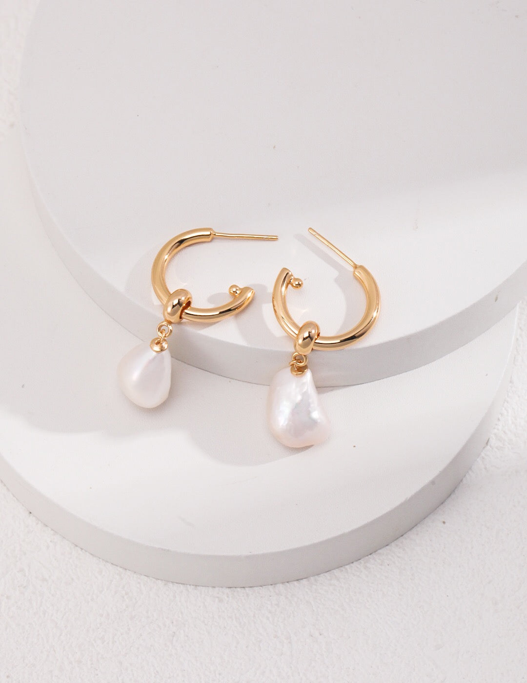 Large Pearl Drop Hoop Earrings featuring natural freshwater pearls and gold vermeil, elegantly designed for a luxurious look.