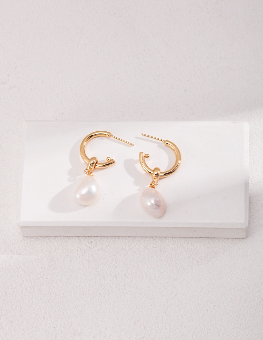 Large Pearl Drop Hoop Earrings featuring natural freshwater pearls and gold vermeil, elegantly designed for a luxurious look.