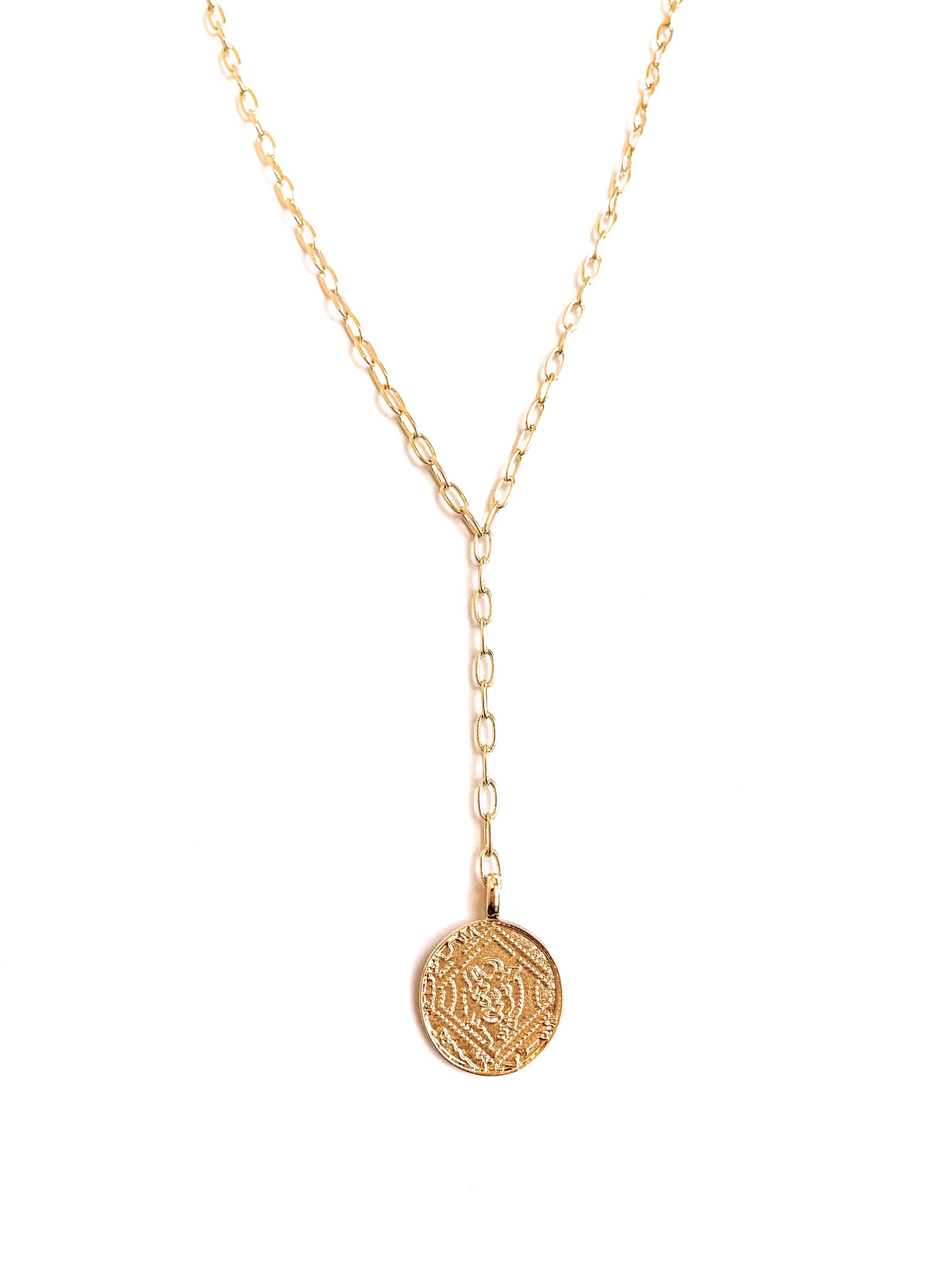 Elegant Gold Coin Lariat Necklace featuring a delicate link chain and a beautiful gold coin pendant, perfect for layering and enhancing any outfit.