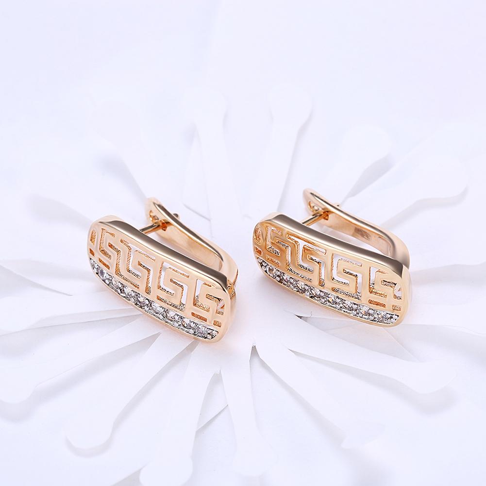 Elegant Laser Cut Elements Clip On Earrings in 14K Gold with certified crystals, showcasing intricate design and hypoallergenic features.