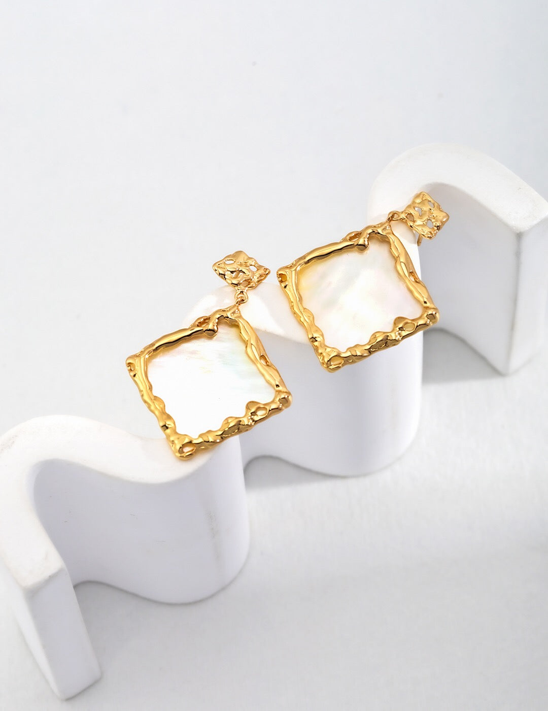 Elegant Lava Shaped Square Mother Of Pearl Earrings with gold vermeil finish, showcasing unique iridescent patterns.