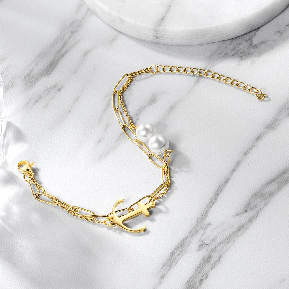 Layered Anchor Pearl Bracelet featuring 316L surgical stainless steel and 14K gold PVD plating, showcasing an elegant layered design.