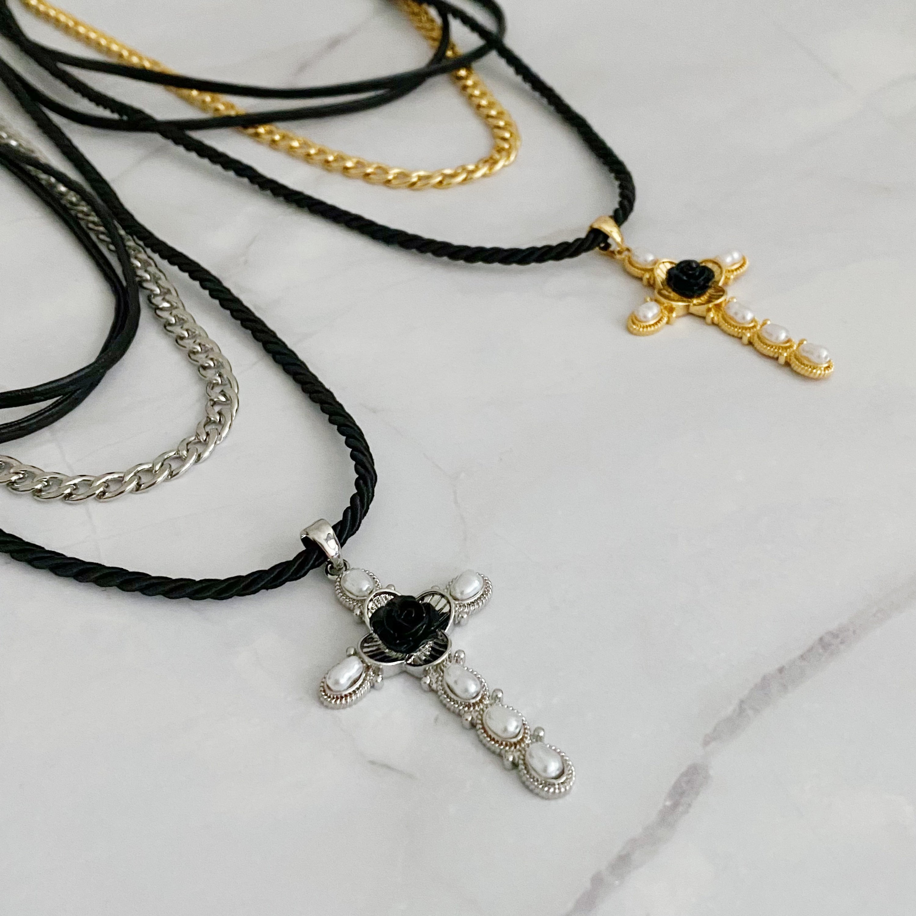 Layered Black Rose Cross Necklace featuring vegan leather and a stylish cross pendant, showcasing three layers with an extender.