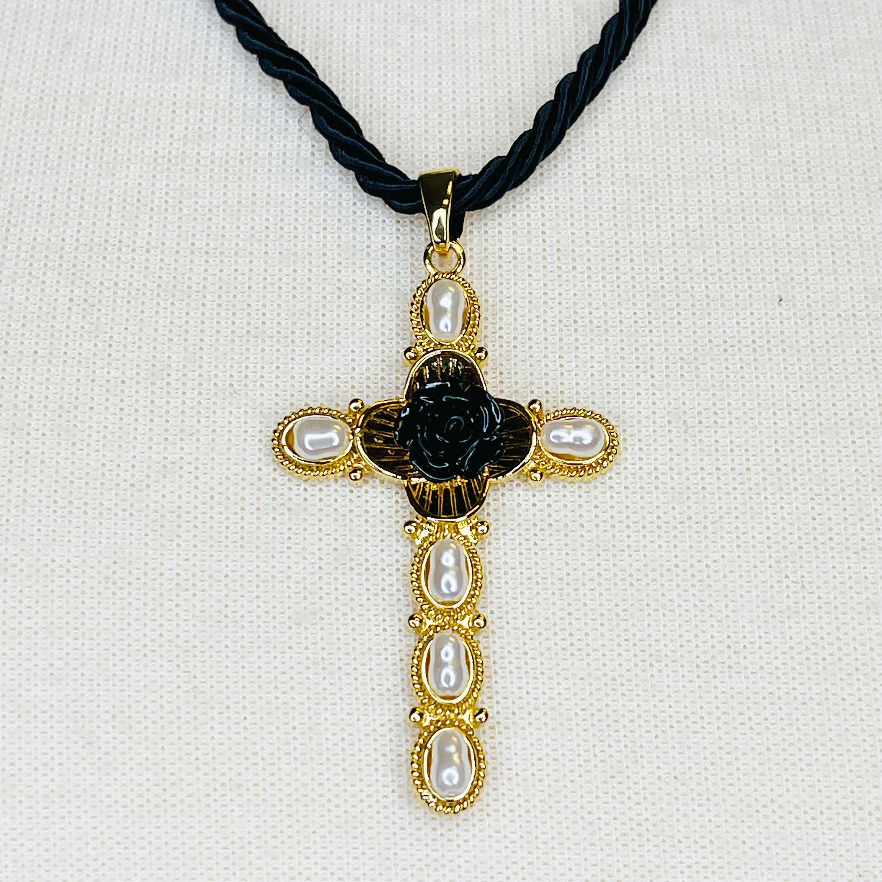 Layered Black Rose Cross Necklace featuring vegan leather and a stylish cross pendant, showcasing three layers with an extender.