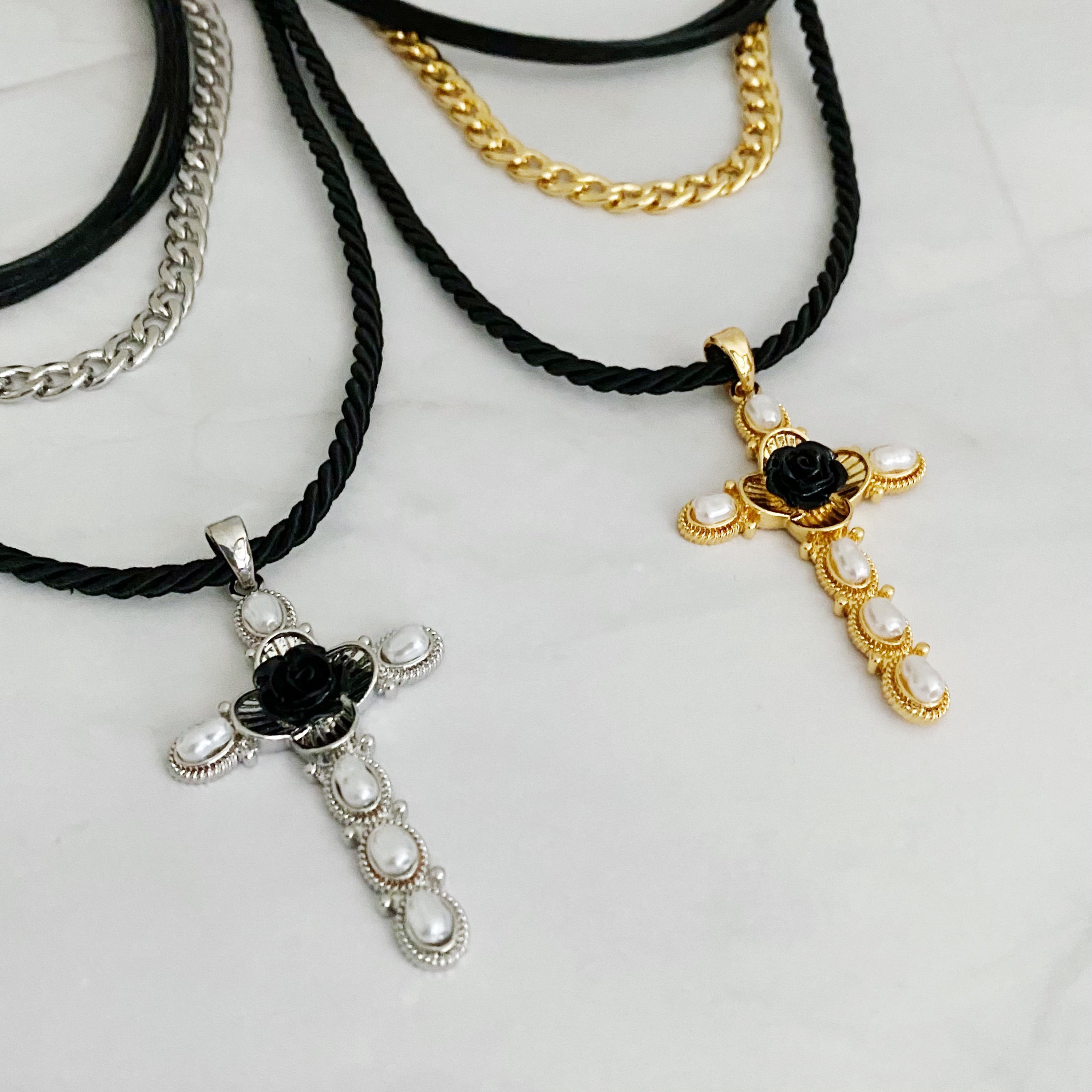 Layered Black Rose Cross Necklace featuring vegan leather and a stylish cross pendant, showcasing three layers with an extender.