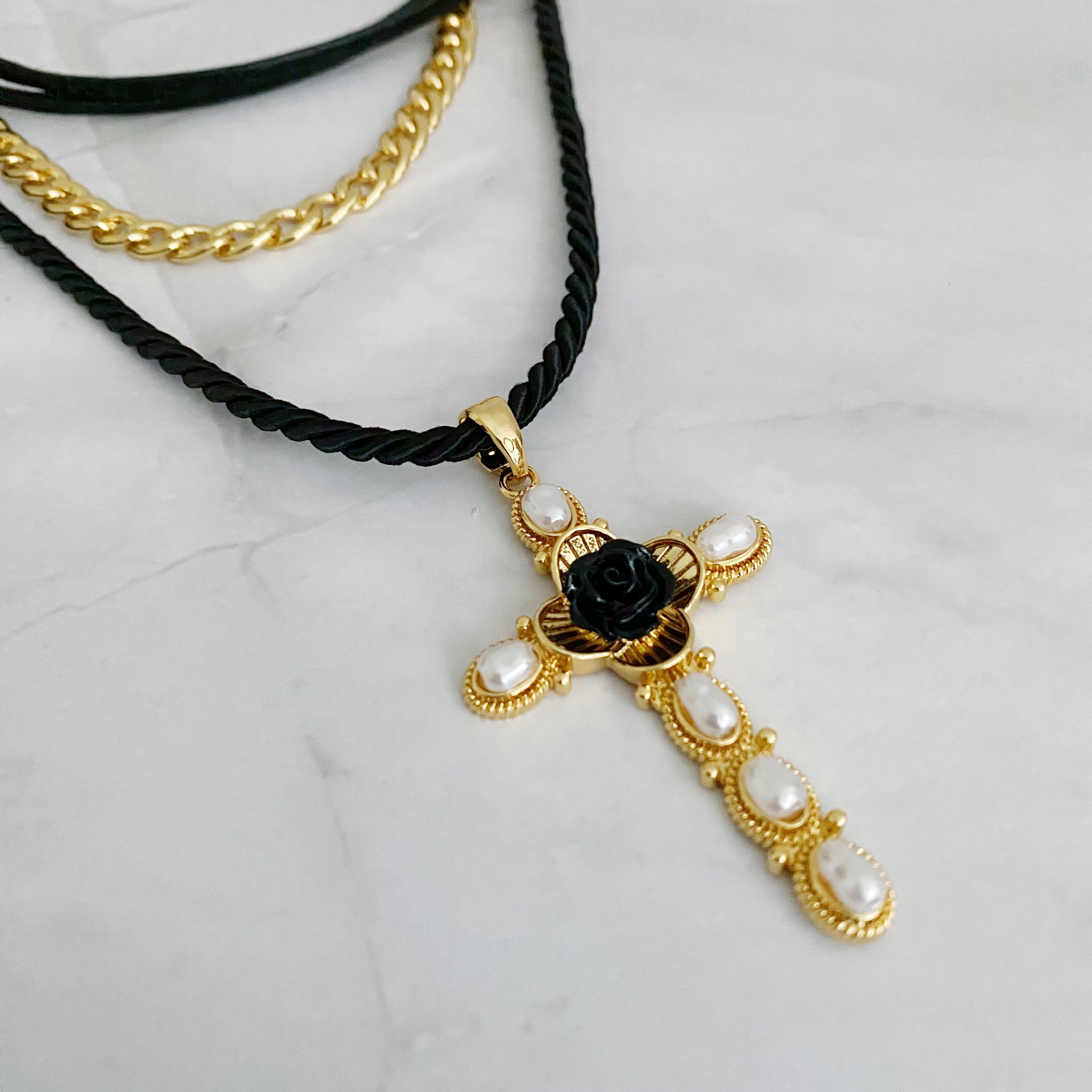 Layered Black Rose Cross Necklace featuring vegan leather and a stylish cross pendant, showcasing three layers with an extender.