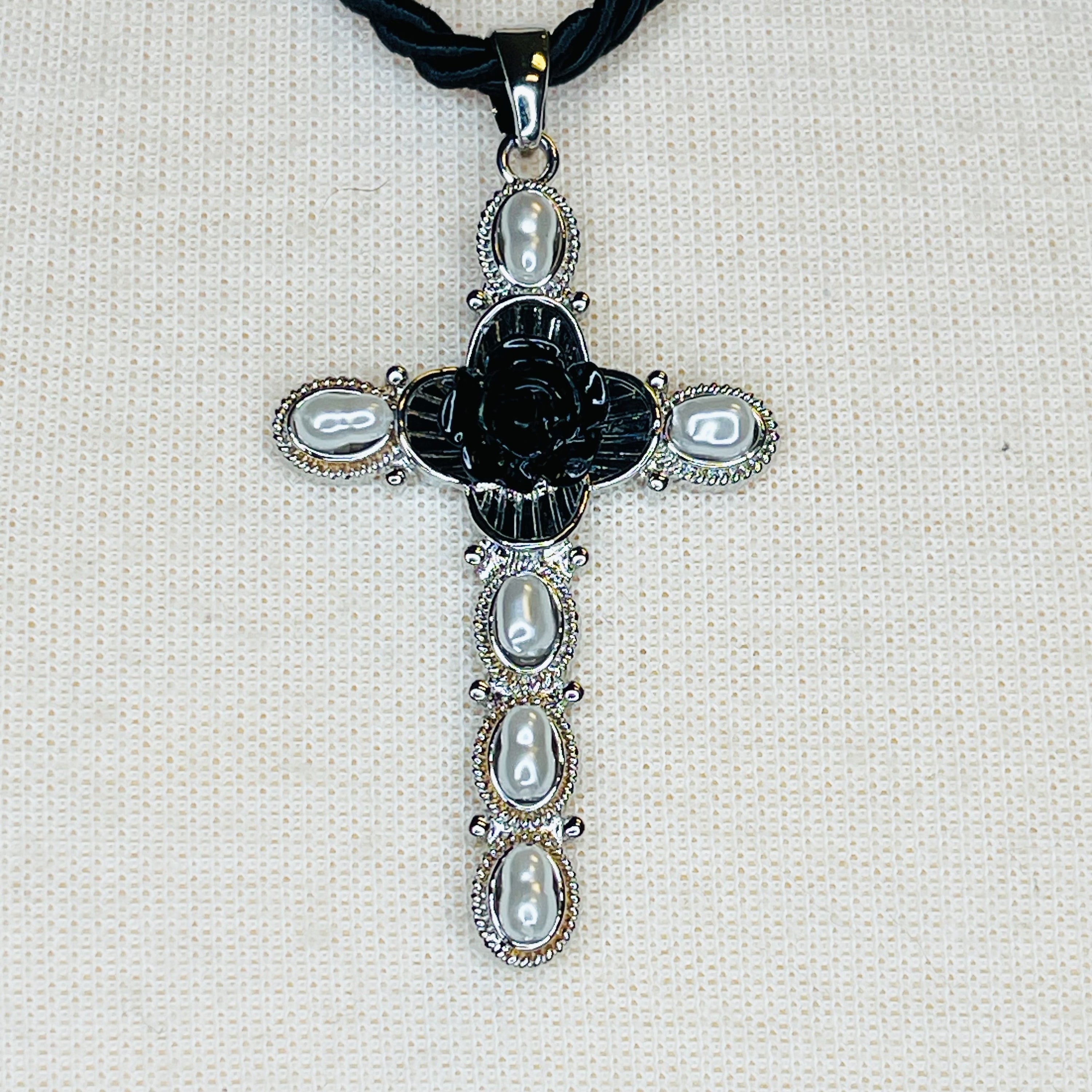 Layered Black Rose Cross Necklace featuring vegan leather and a stylish cross pendant, showcasing three layers with an extender.