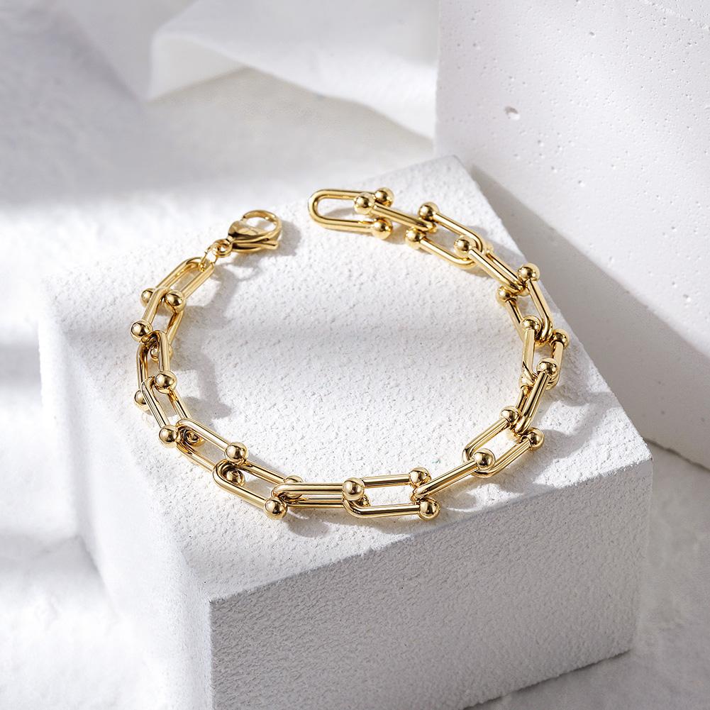 LE CHEVAL BRACELET featuring interlocking magnet-shaped metal design, elegantly displayed in a gift box.