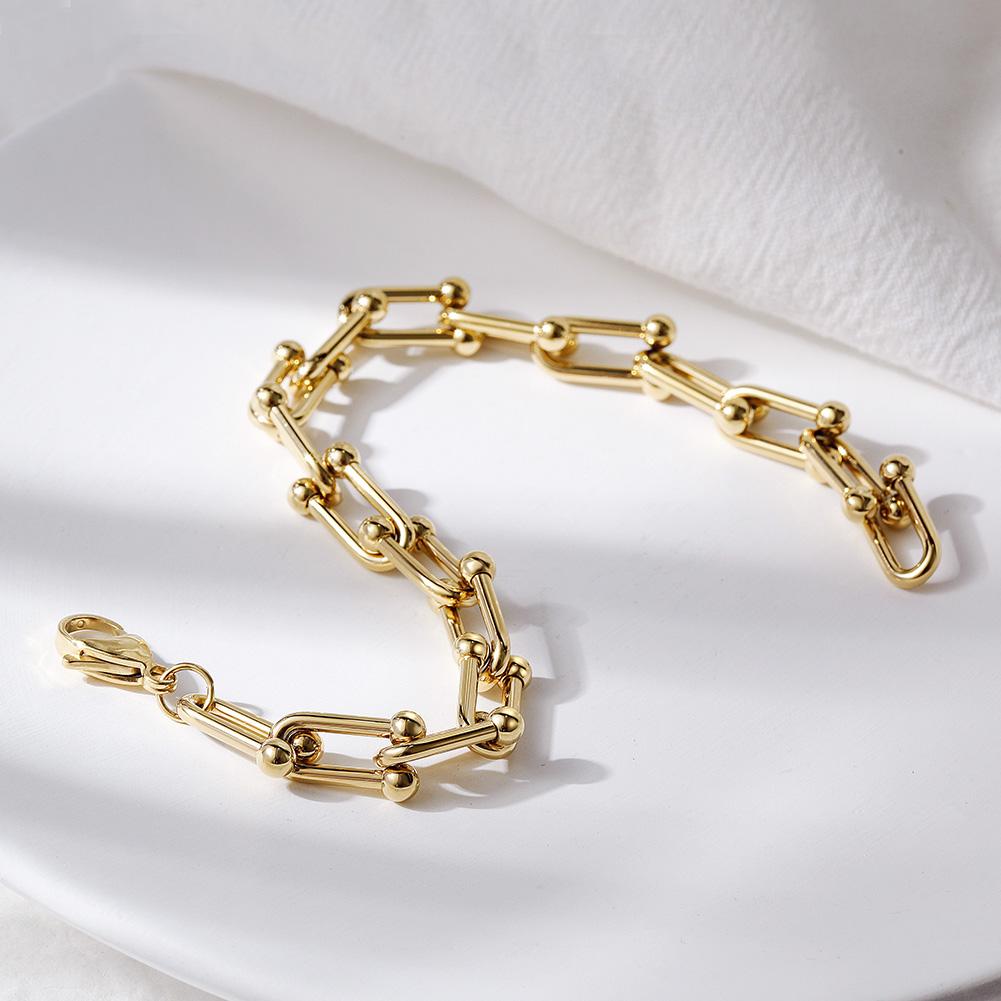 LE CHEVAL BRACELET featuring interlocking magnet-shaped metal design, elegantly displayed in a gift box.