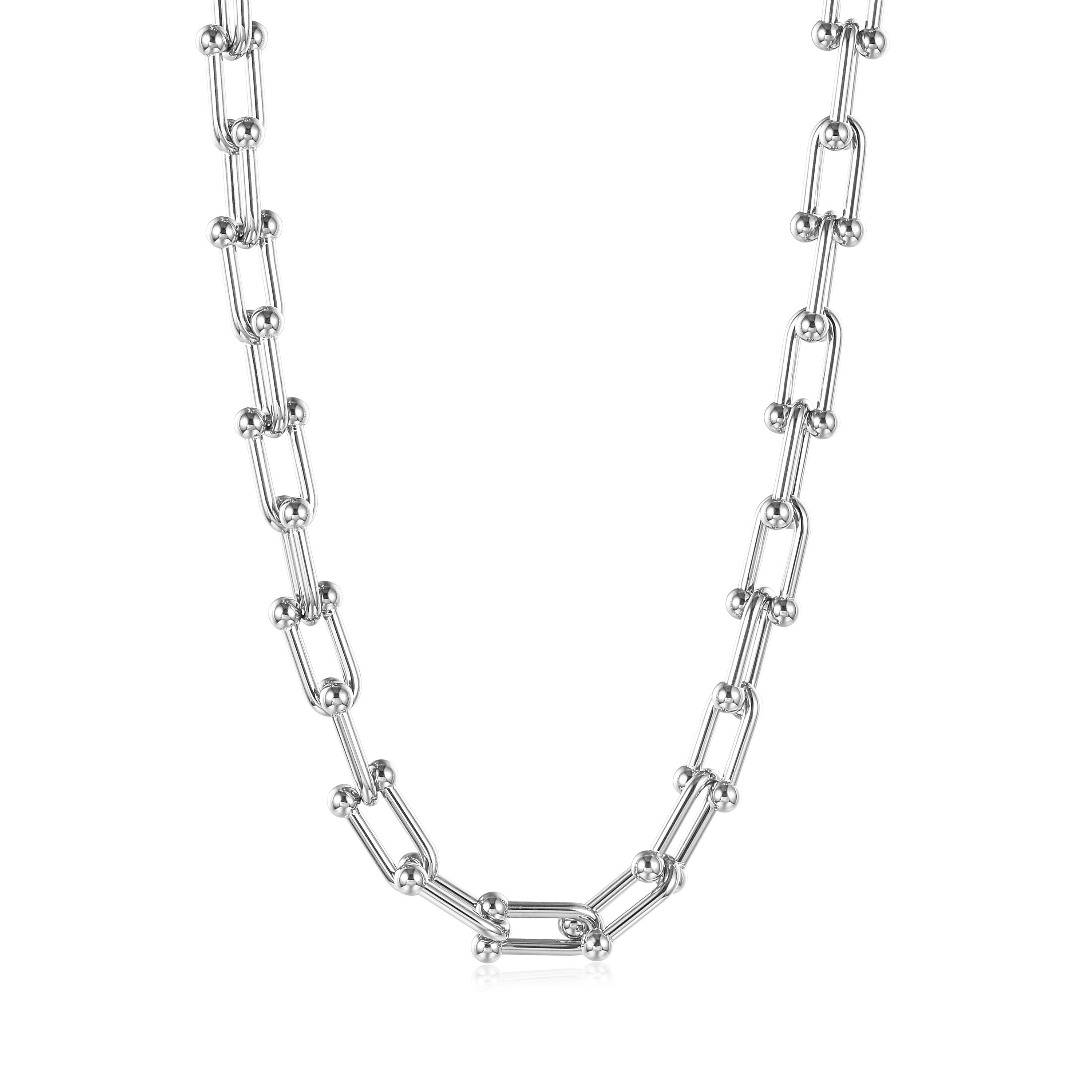 Le Cheval Necklace featuring horse shoe links in stainless steel, elegantly displayed in a gift box.