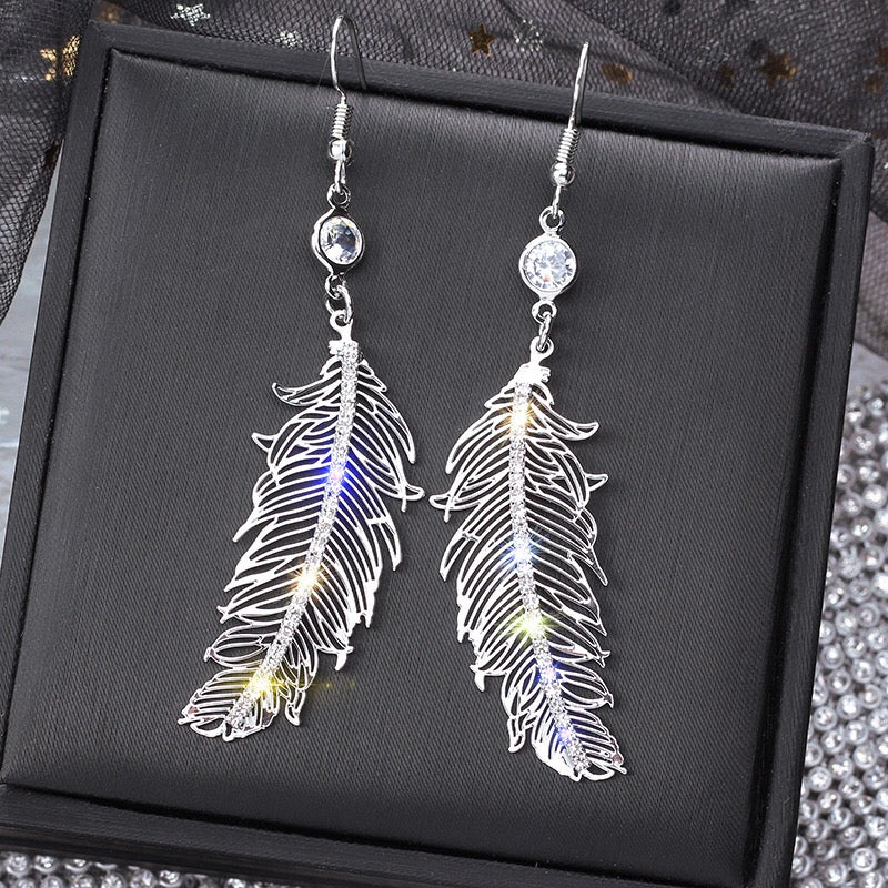 Elegant Leaf Diamond Earrings featuring alloy, rhinestone, and 925 silver accents, showcasing a stylish leaf design.