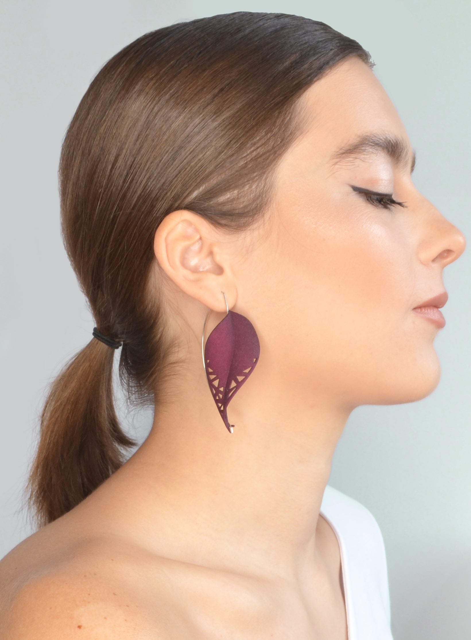 Oversize Leaf Earrings in vibrant colors inspired by rainforest flora, featuring a lightweight design and hypoallergenic materials.