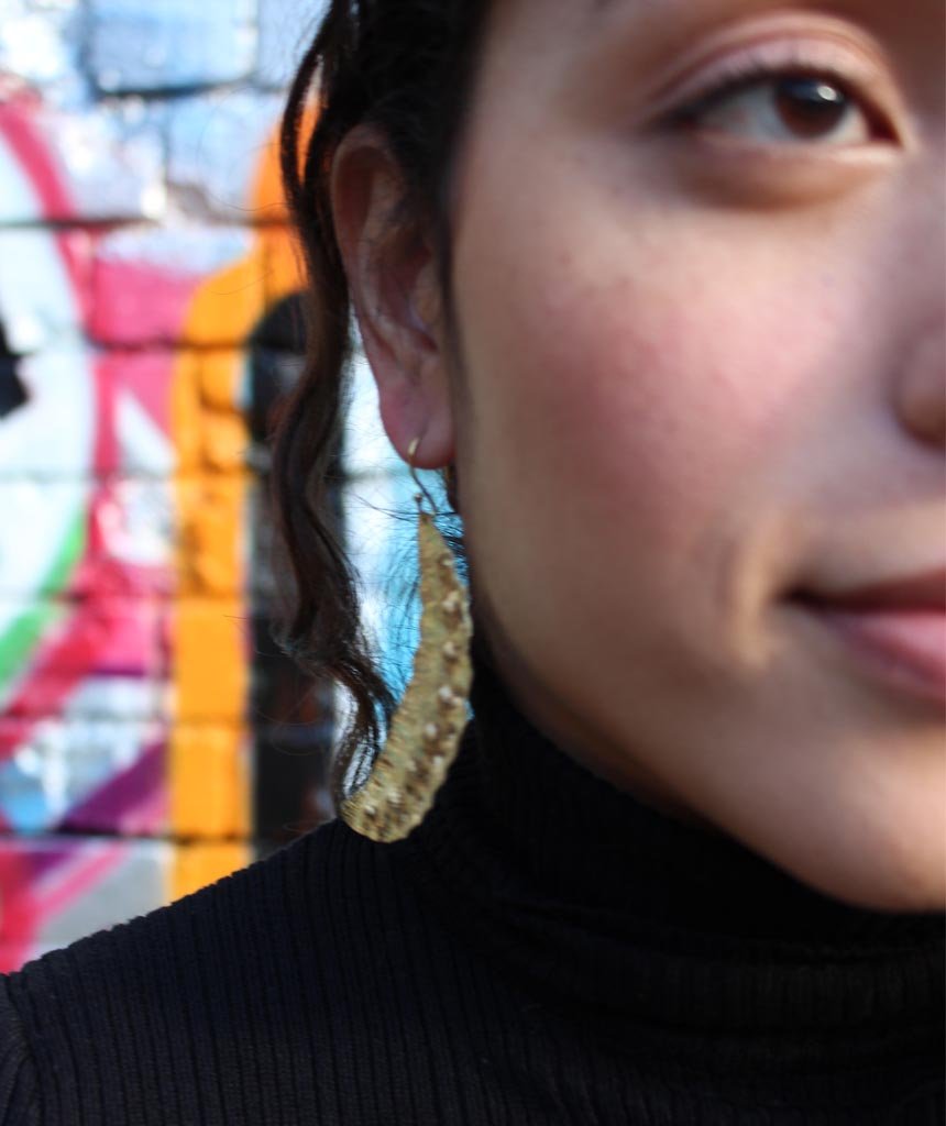 Elegant Leaf Statement Earrings in brass with intricate tribal design, available in gold and silver.