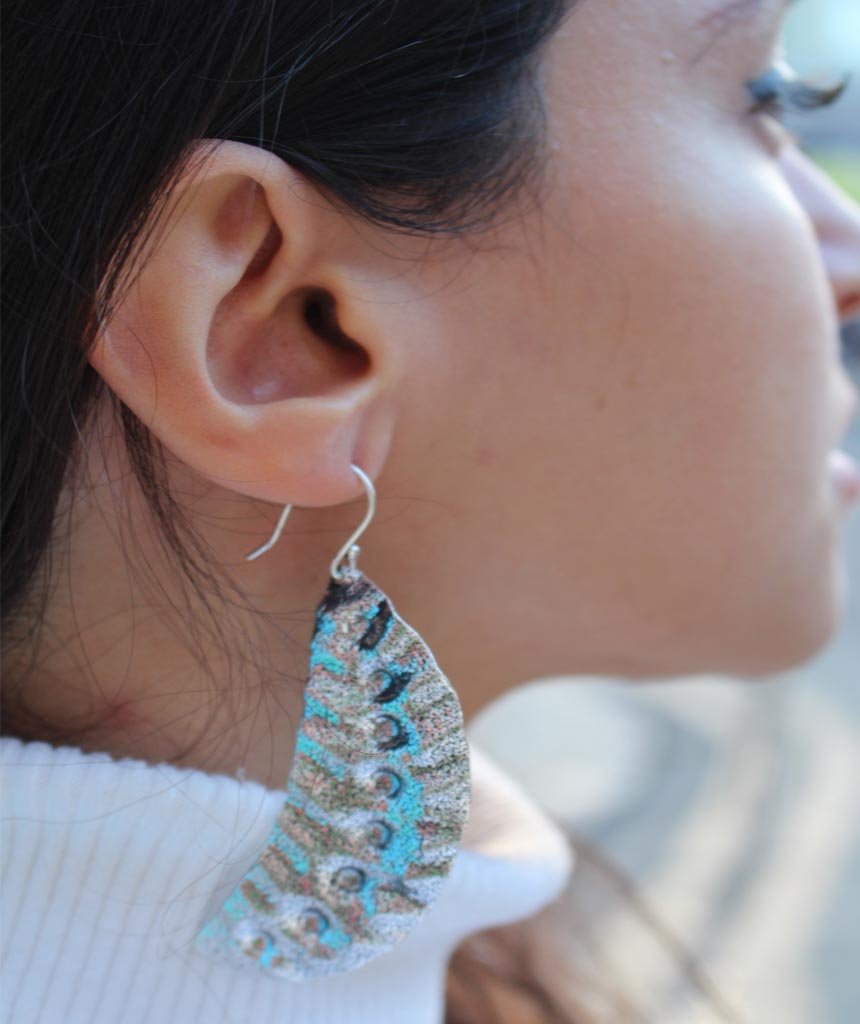 Elegant Leaf Statement Earrings in brass with intricate tribal design, available in gold and silver.