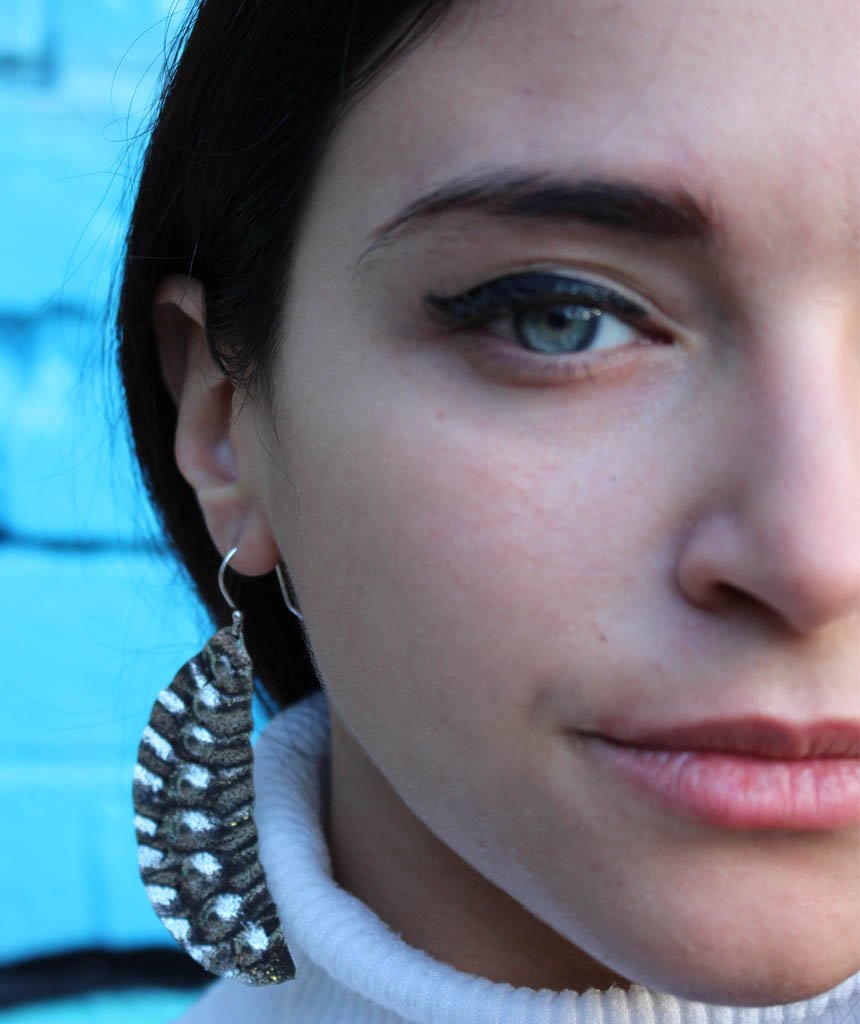 Elegant Leaf Statement Earrings in brass with intricate tribal design, available in gold and silver.