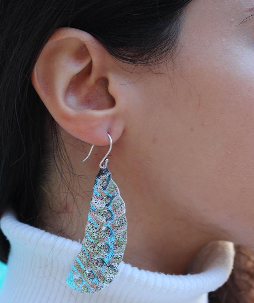 Elegant Leaf Statement Earrings in brass with intricate tribal design, available in gold and silver.