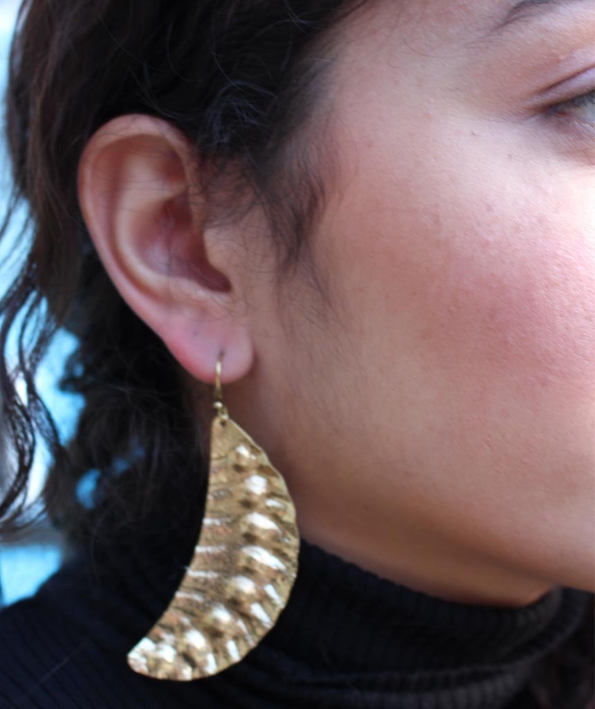 Elegant Leaf Statement Earrings in brass with intricate tribal design, available in gold and silver.