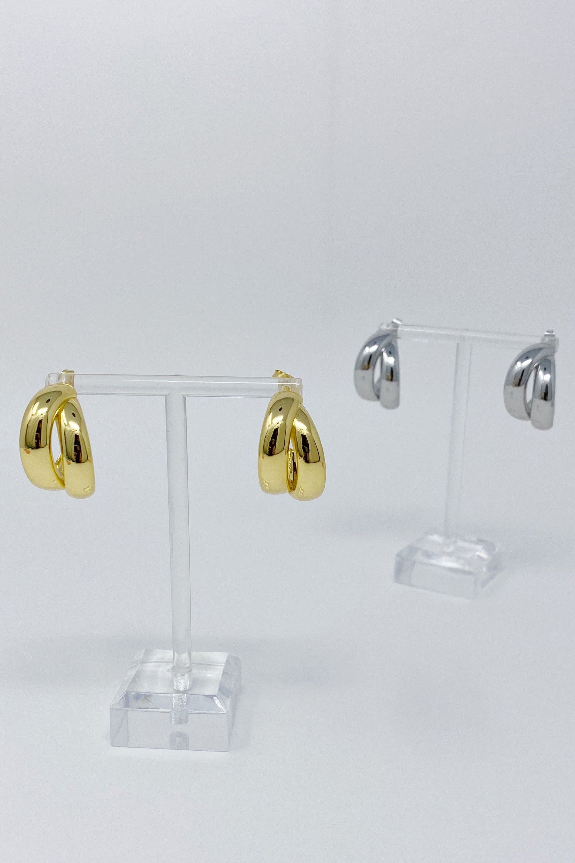 Stylish Lean On Me Hoop Earrings in 18K Gold or Rhodium plated brass, showcasing a chic and edgy design.