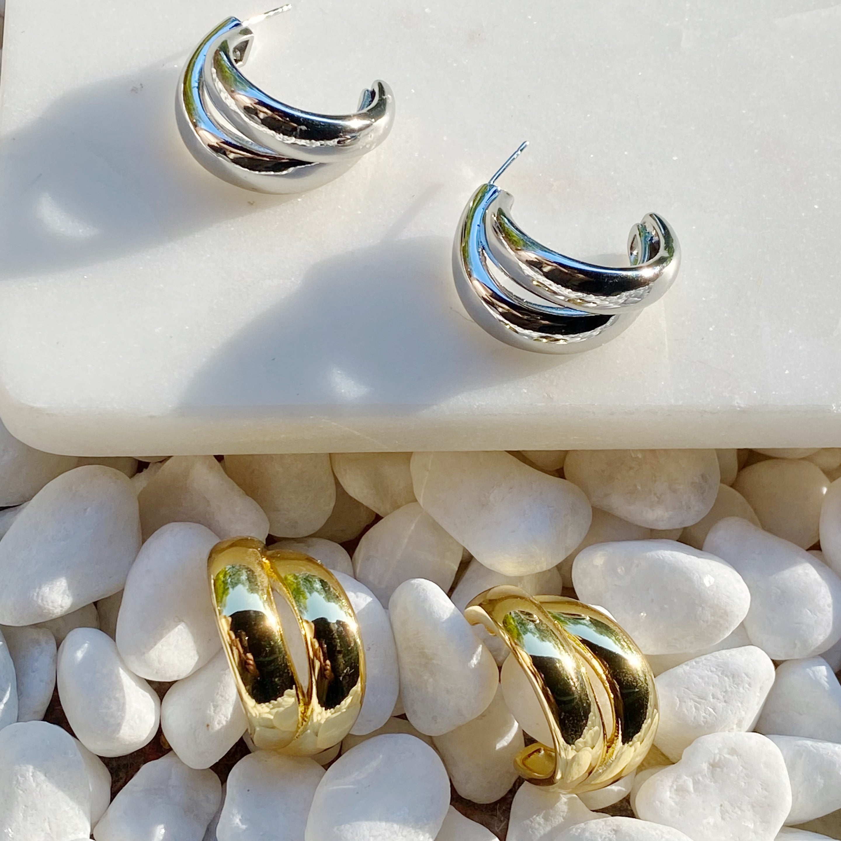 Stylish Lean On Me Hoop Earrings in 18K Gold or Rhodium plated brass, showcasing a chic and edgy design.