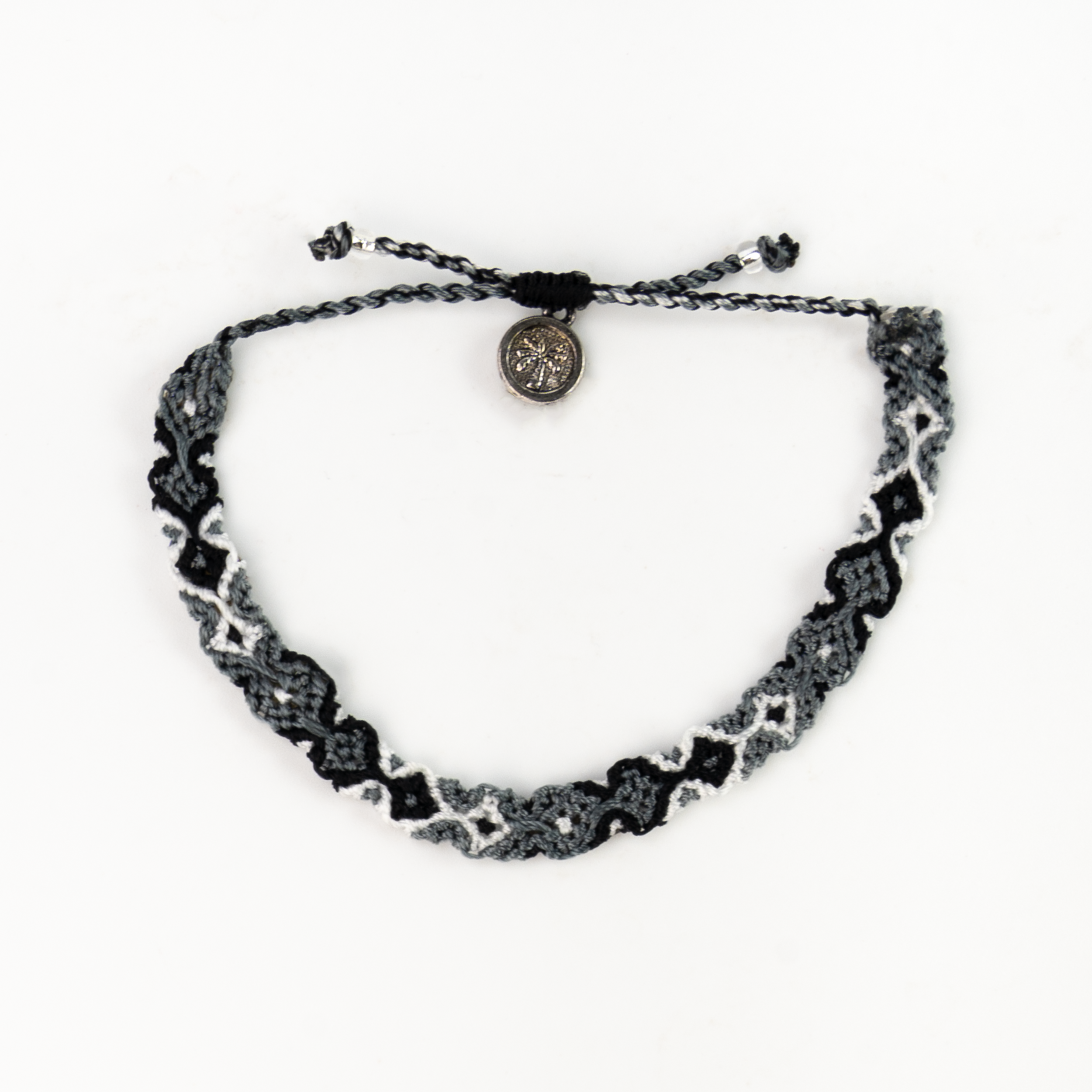 Leme Surf Anklet in black and white with grey accents, adjustable design for comfortable wear.